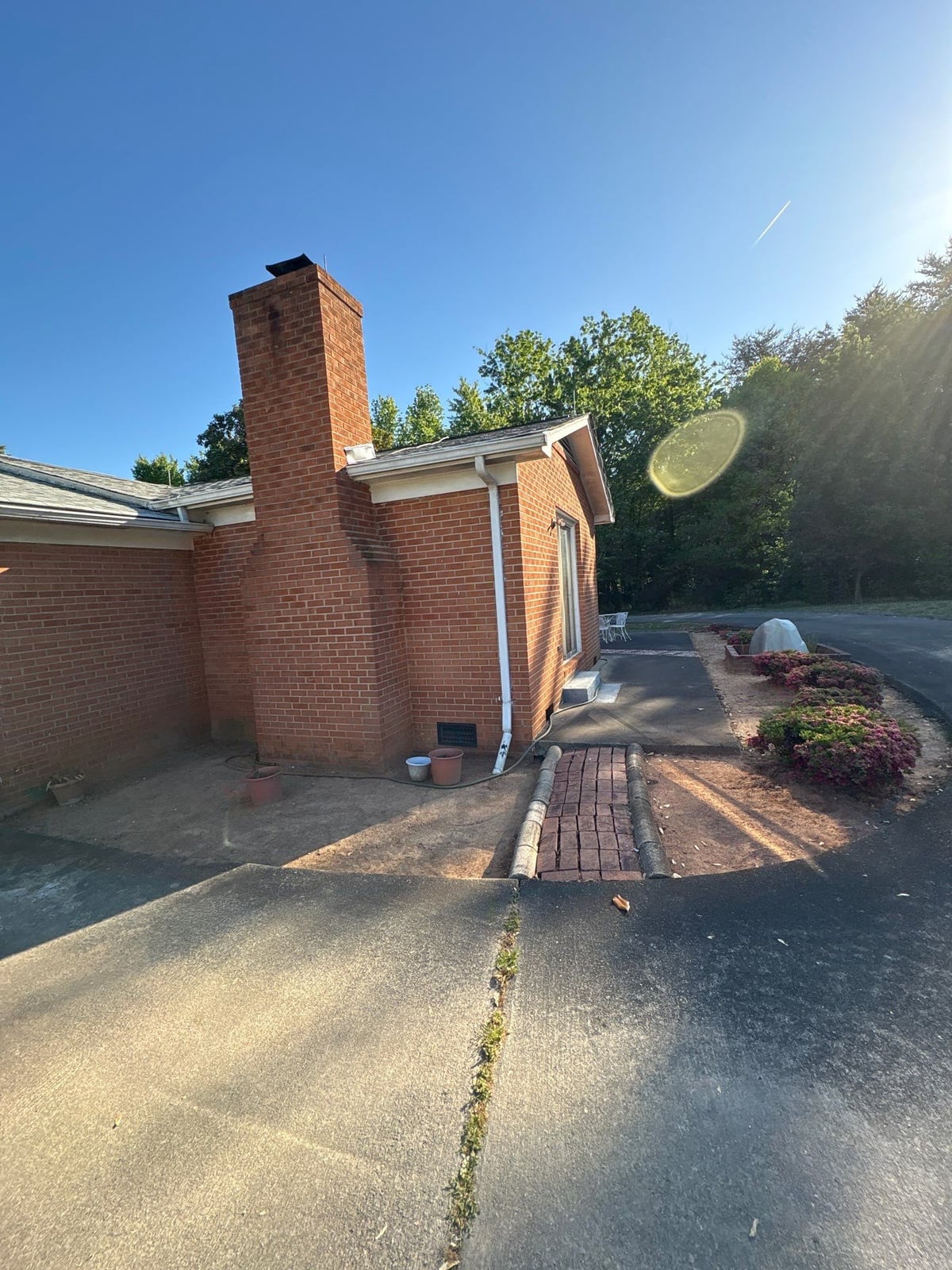 Exterior carport ceiling and concrete driveway pressure washing