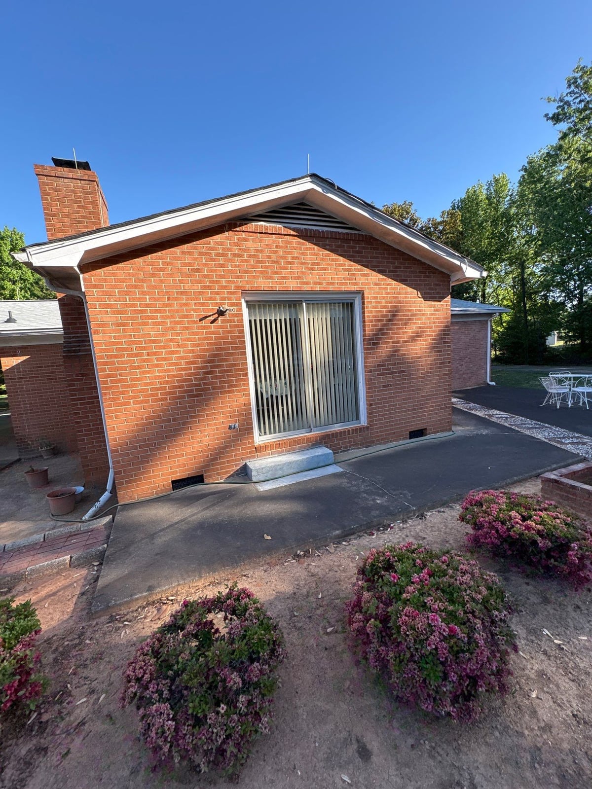 Exterior carport ceiling and concrete driveway pressure washing