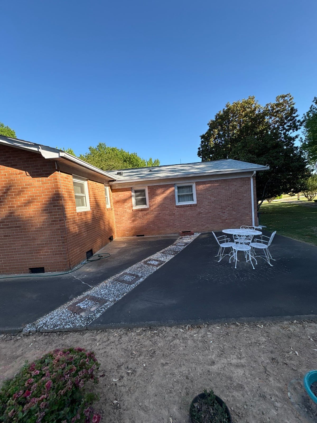 Exterior carport ceiling and concrete driveway pressure washing