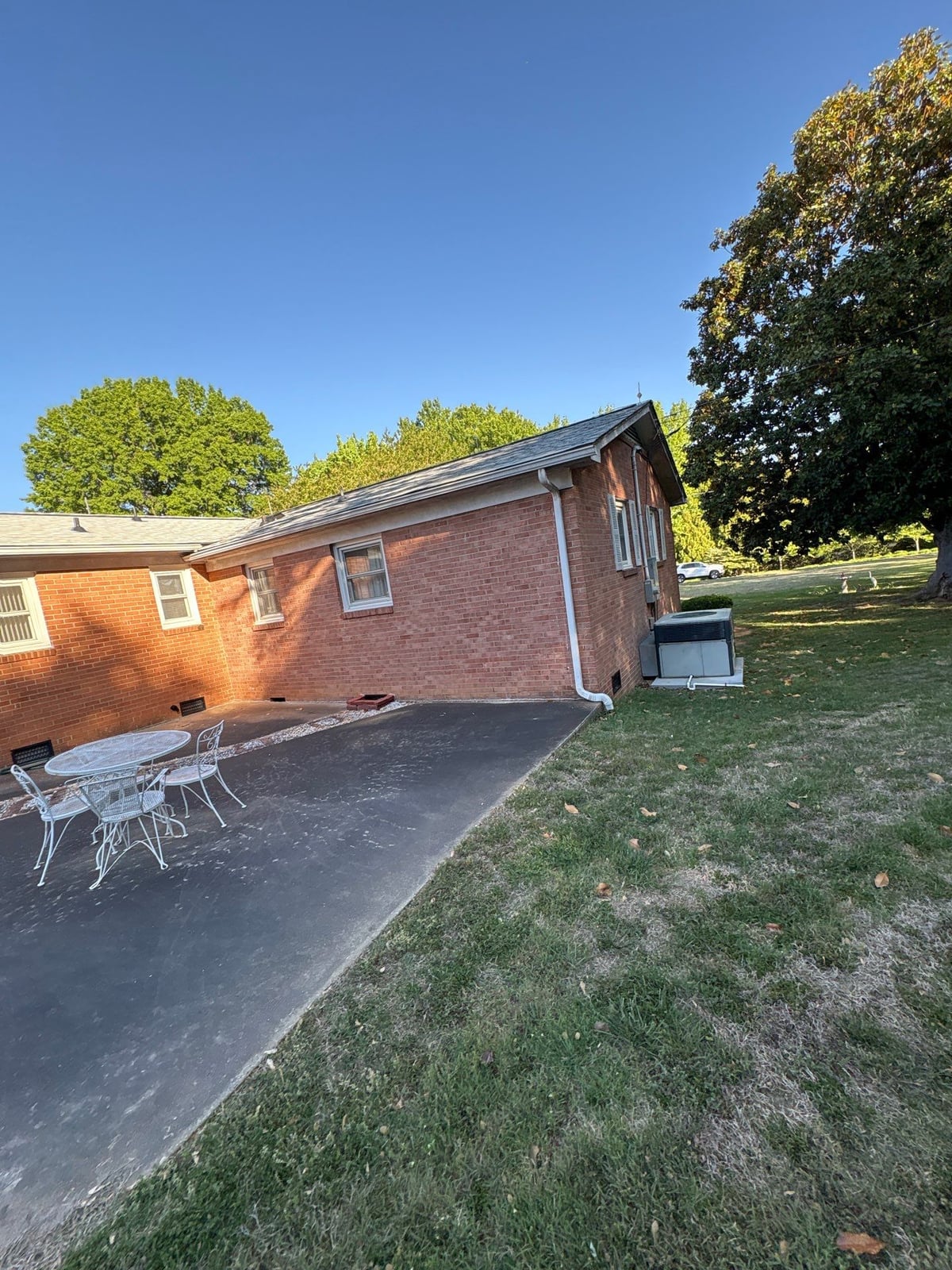Exterior carport ceiling and concrete driveway pressure washing