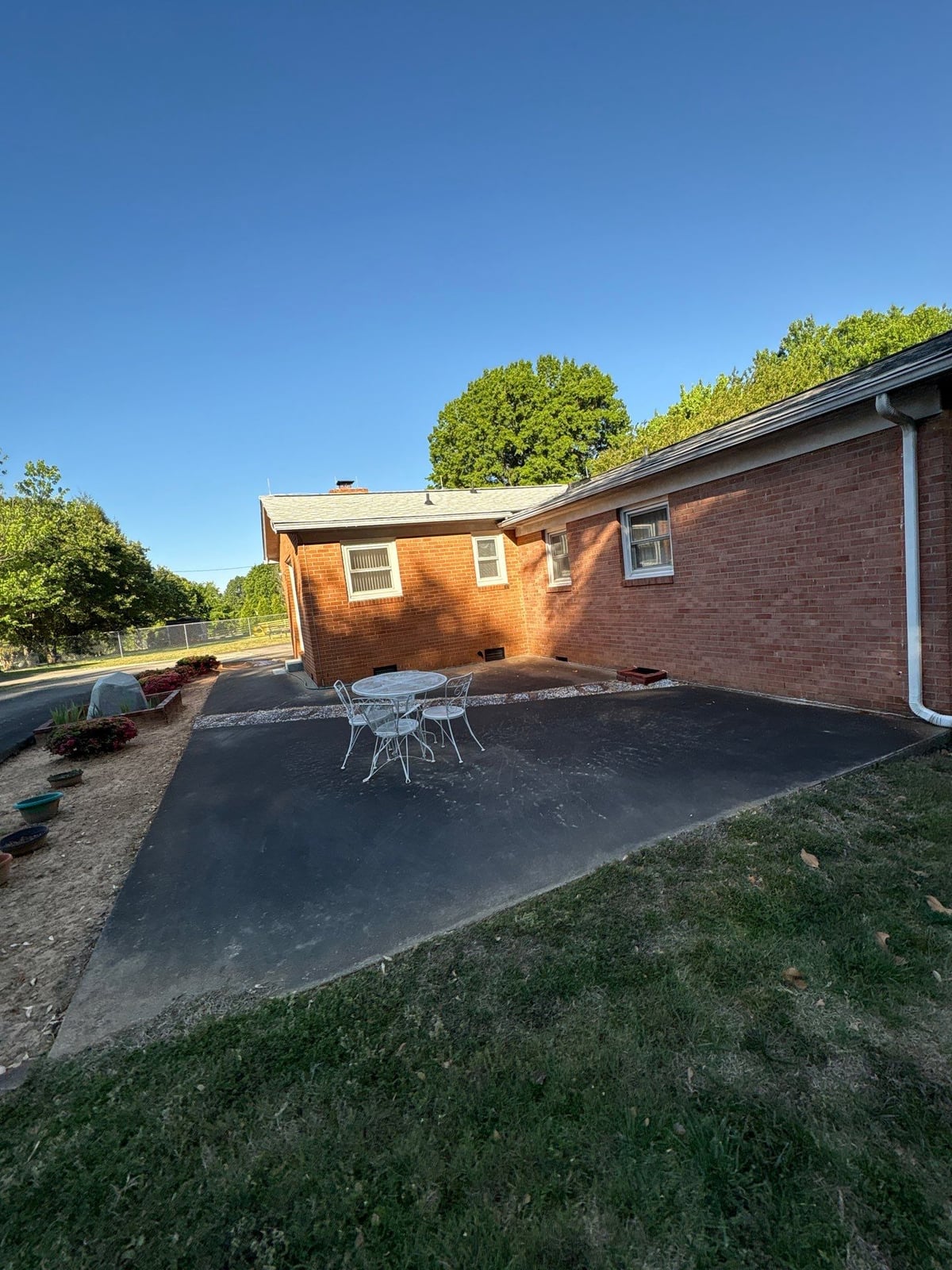 Exterior carport ceiling and concrete driveway pressure washing