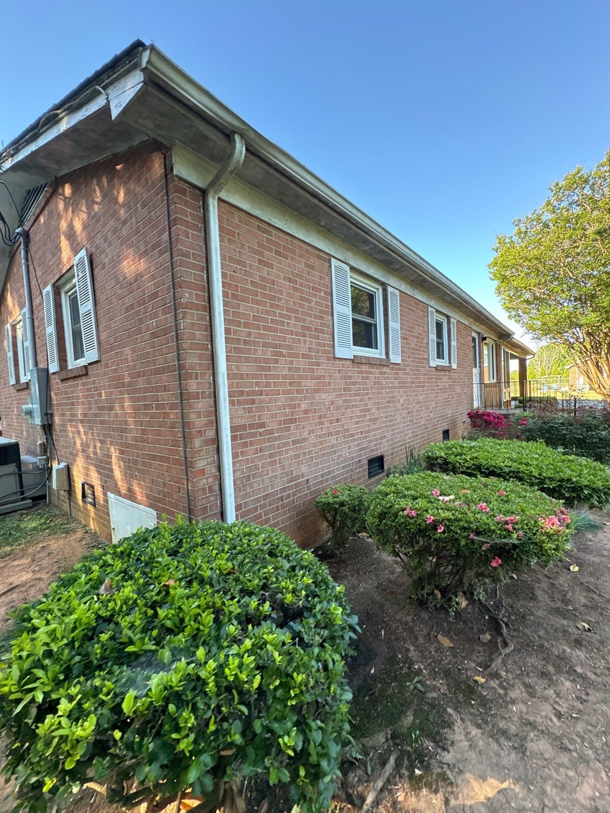 Exterior carport ceiling and concrete driveway pressure washing