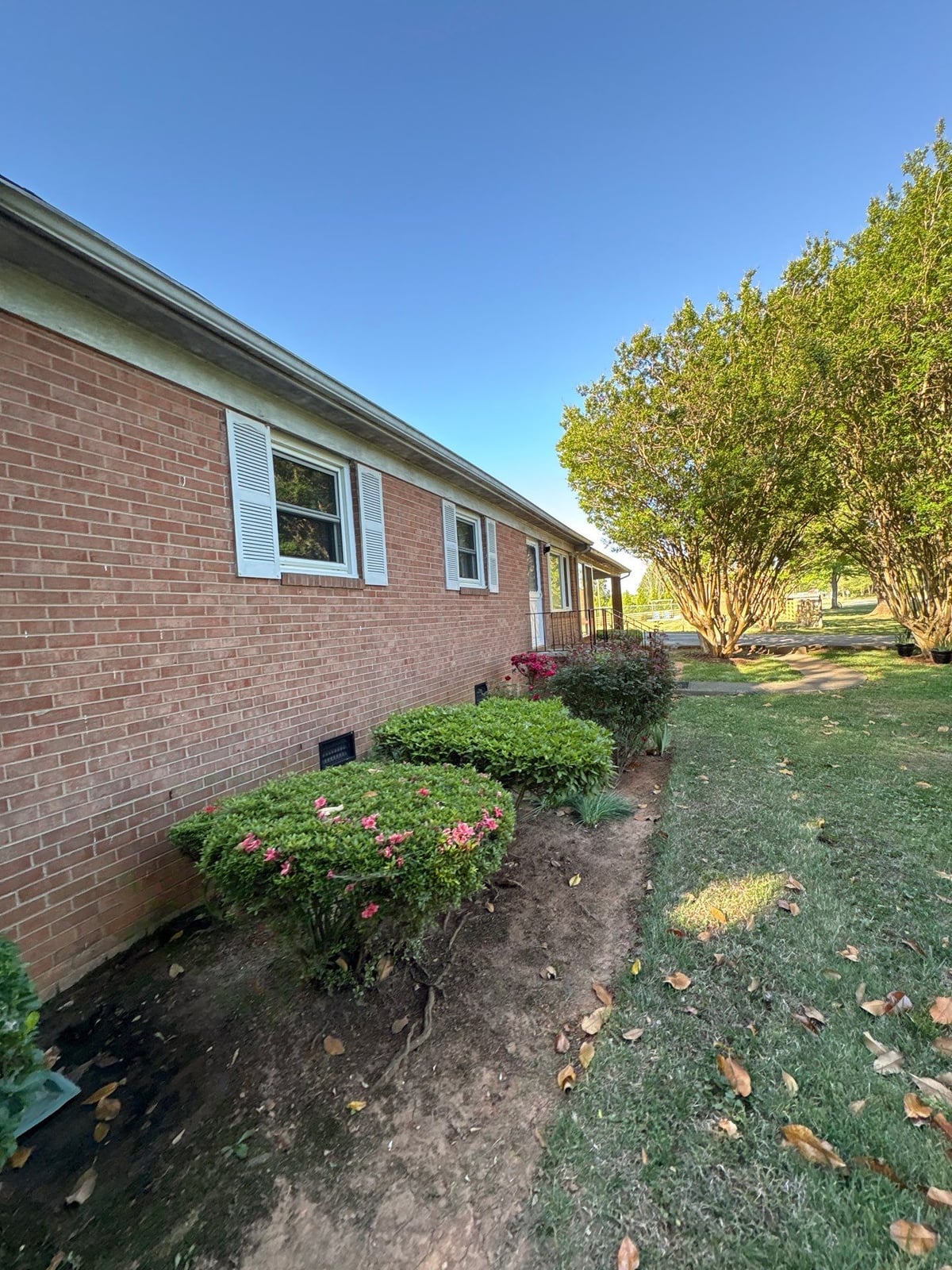 Exterior carport ceiling and concrete driveway pressure washing