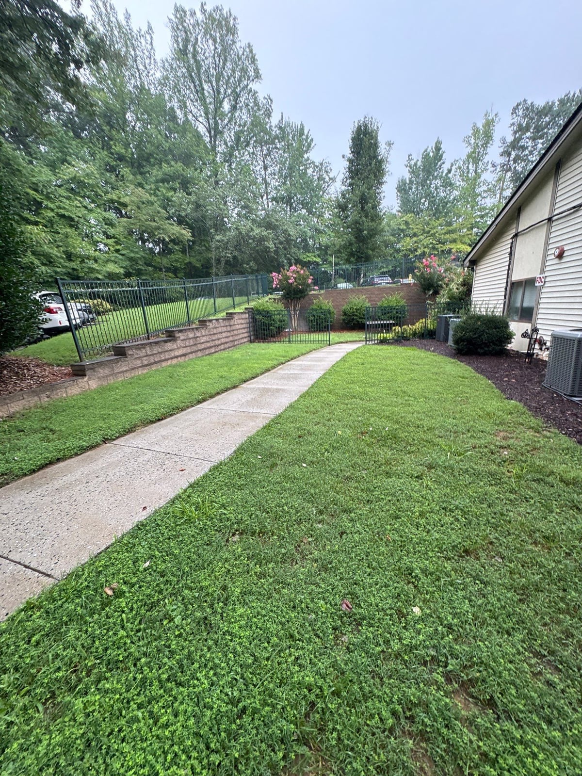 Exterior building washing and cleaning of siding and entryway