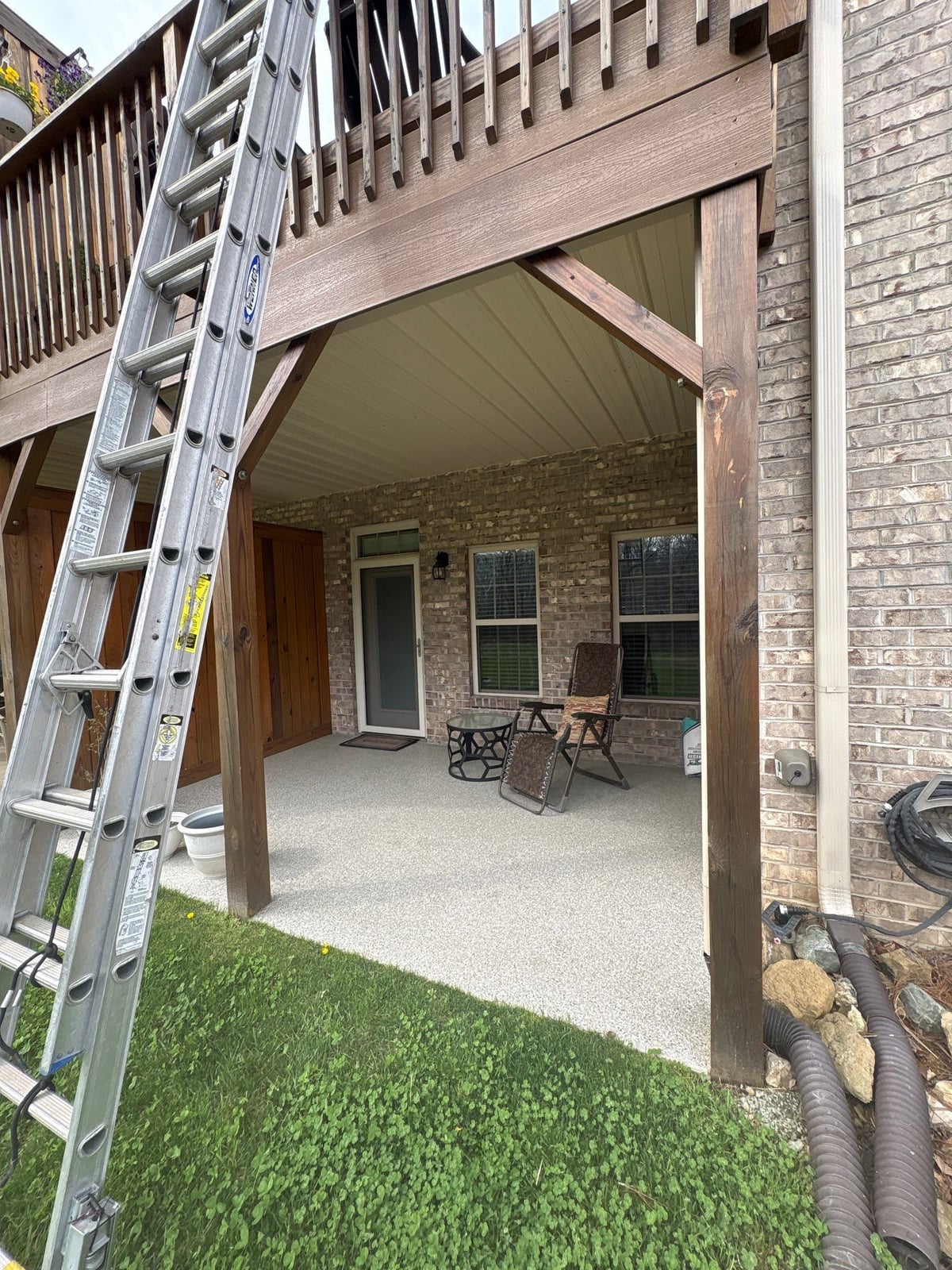 Exterior brick wall and garage door pressure washing