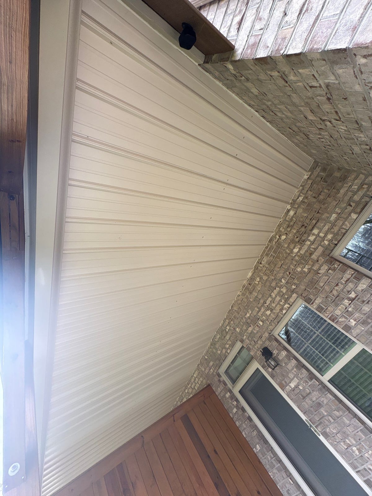 Exterior brick wall and garage door pressure washing