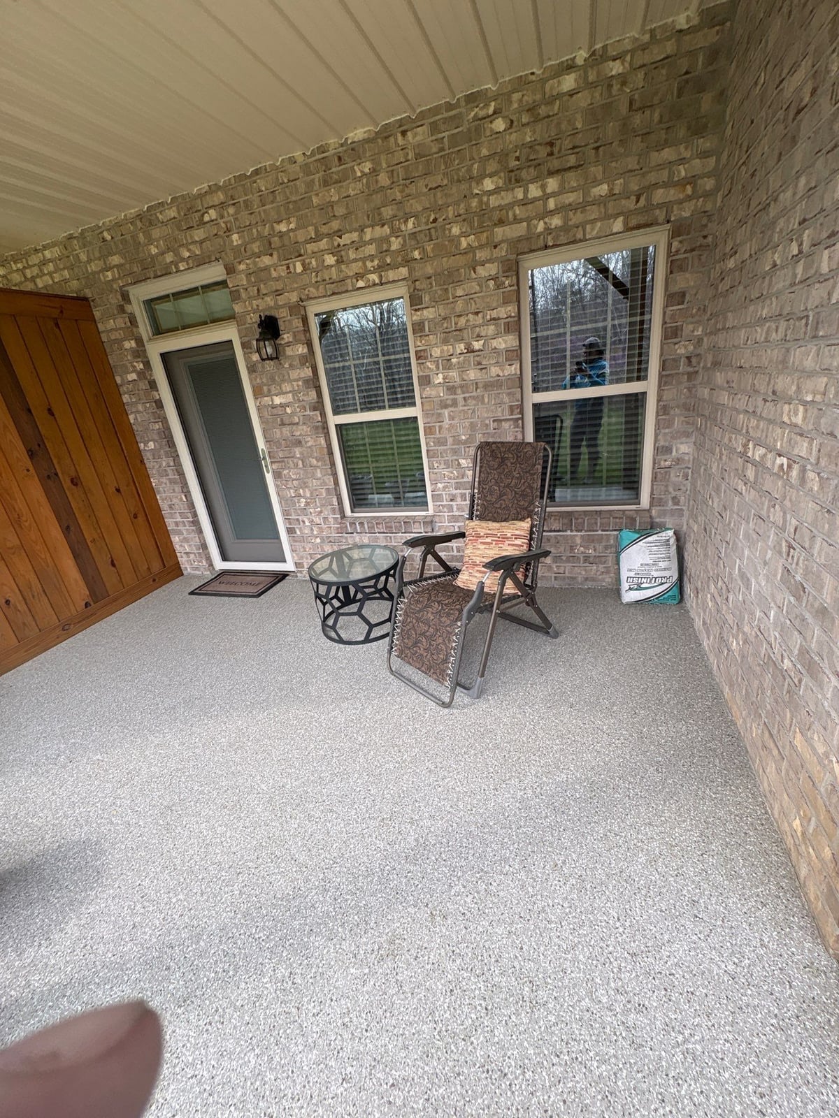 Exterior brick wall and garage door pressure washing
