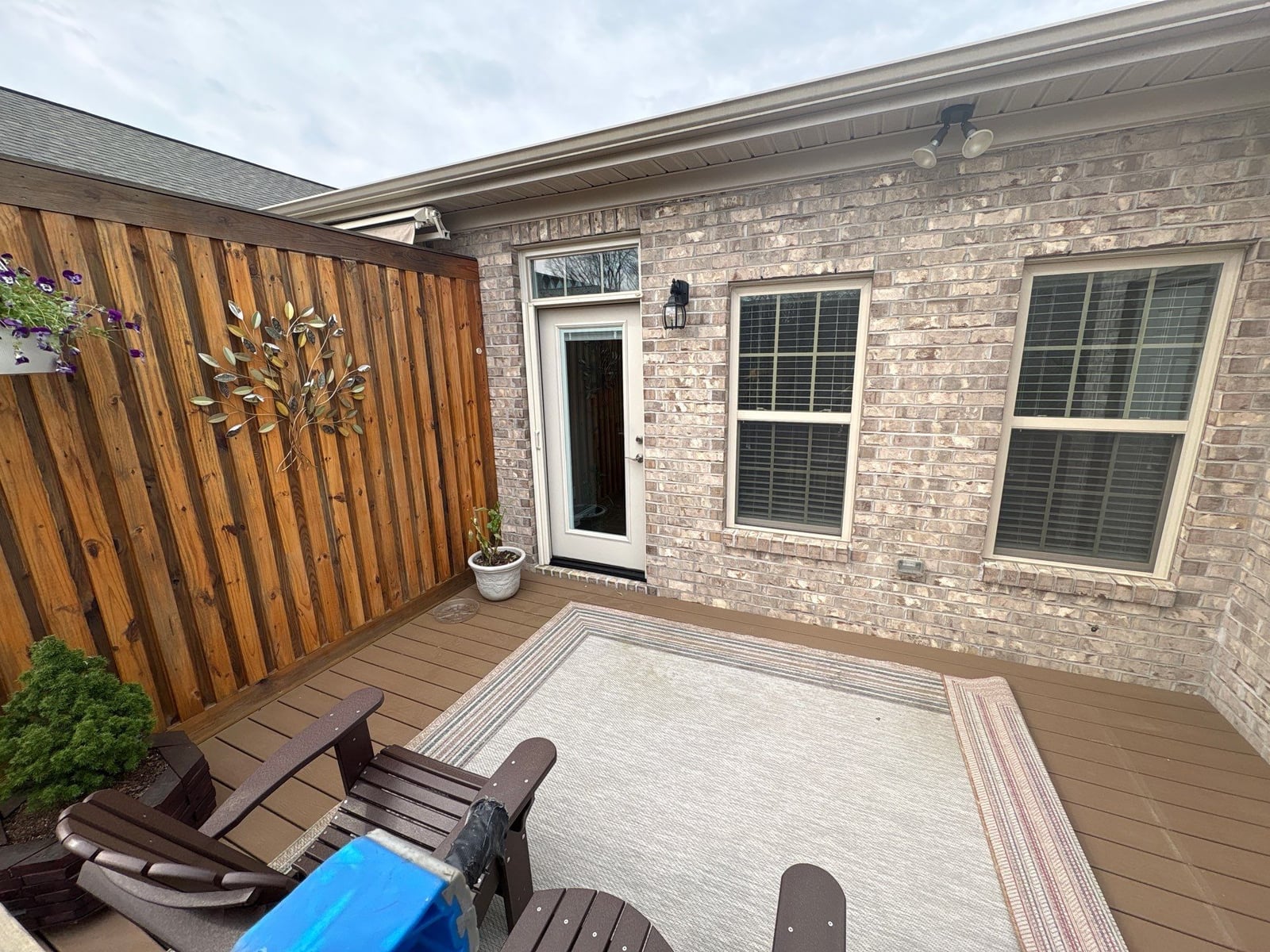 Exterior brick wall and garage door pressure washing