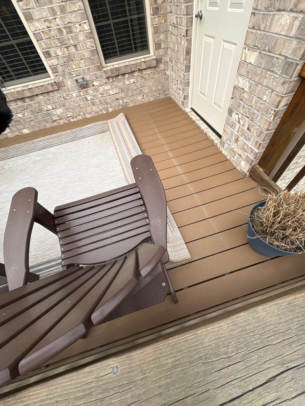 Exterior brick wall and garage door pressure washing