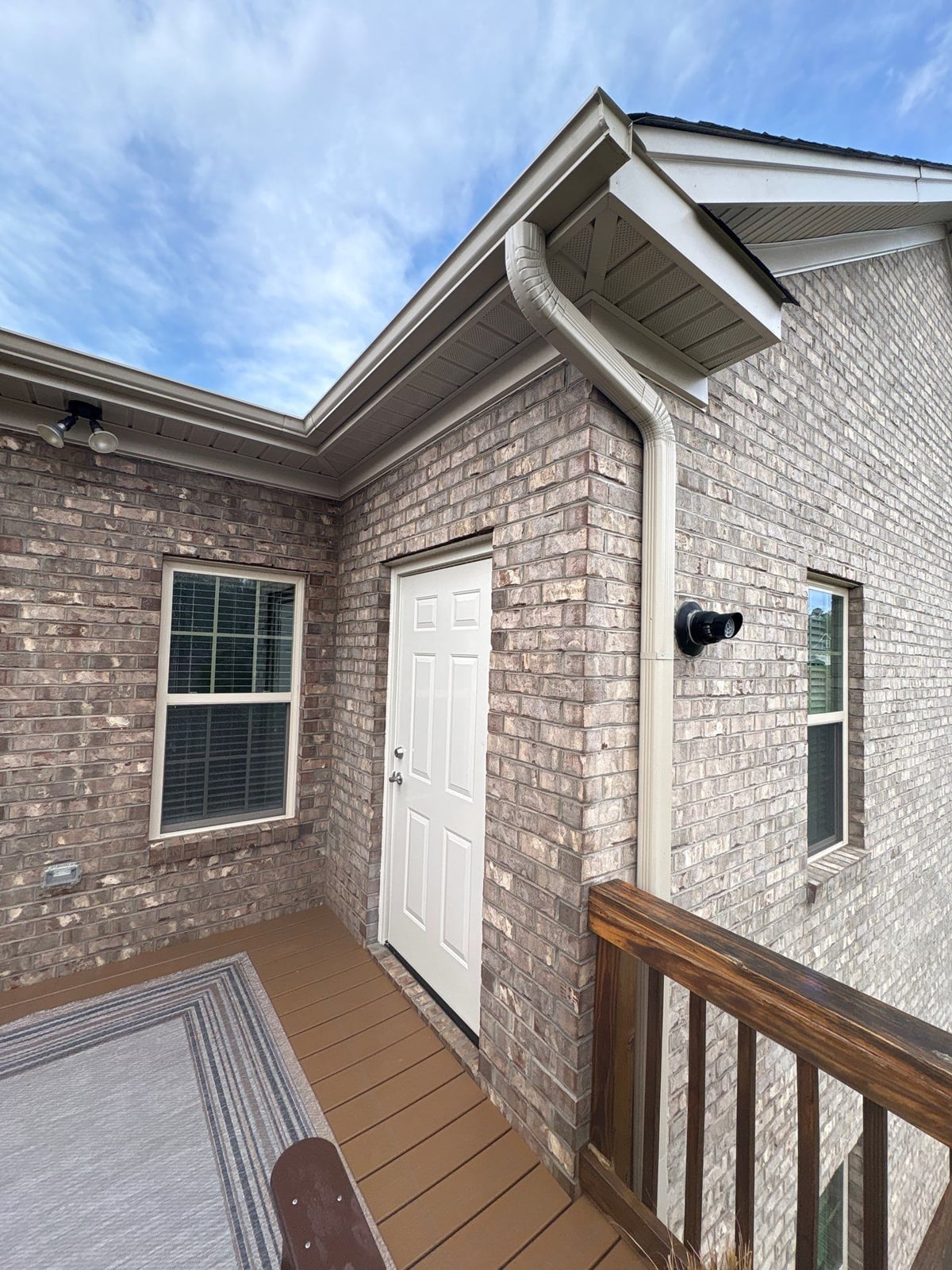 Exterior brick wall and garage door pressure washing