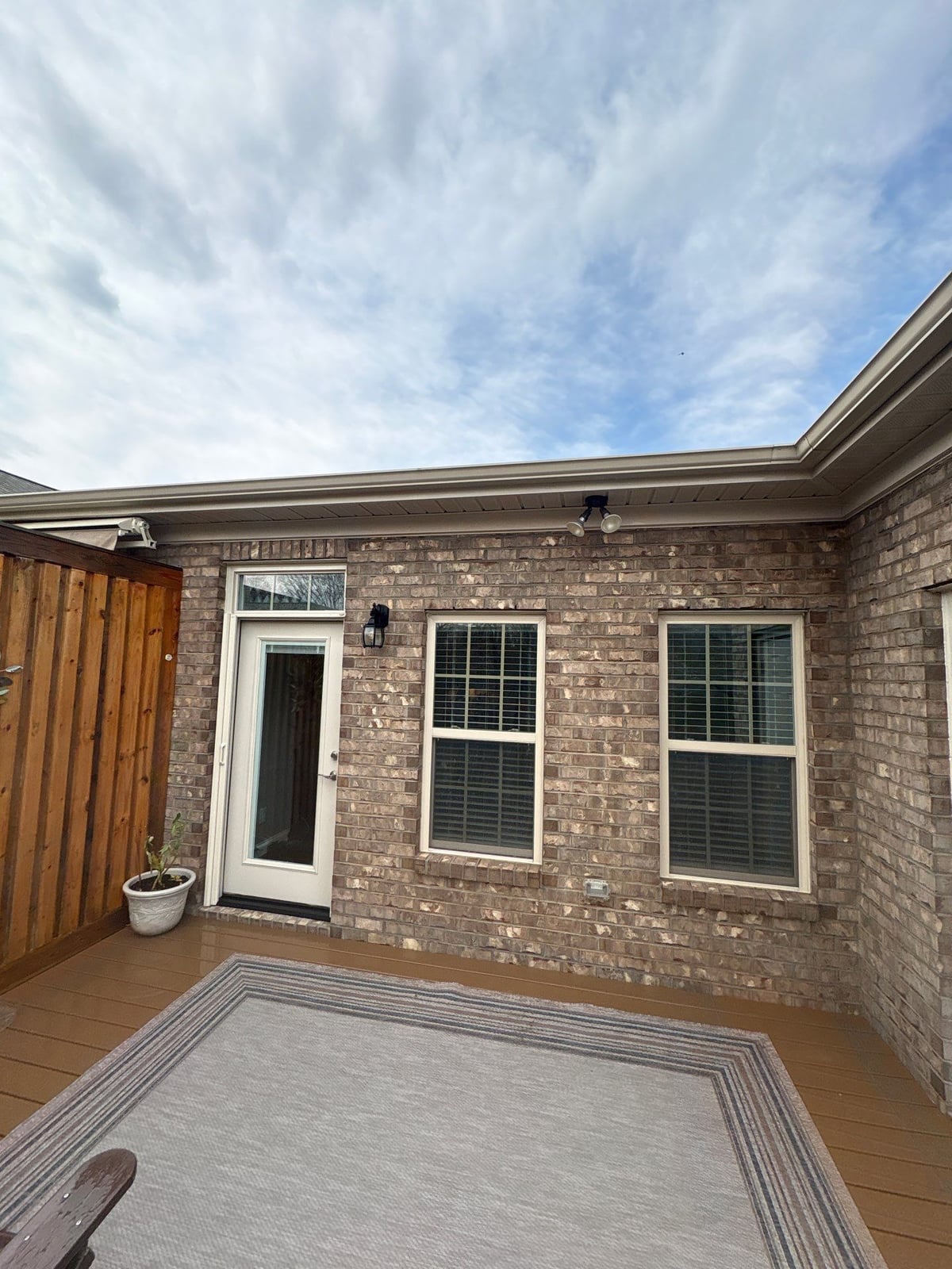 Exterior brick wall and garage door pressure washing