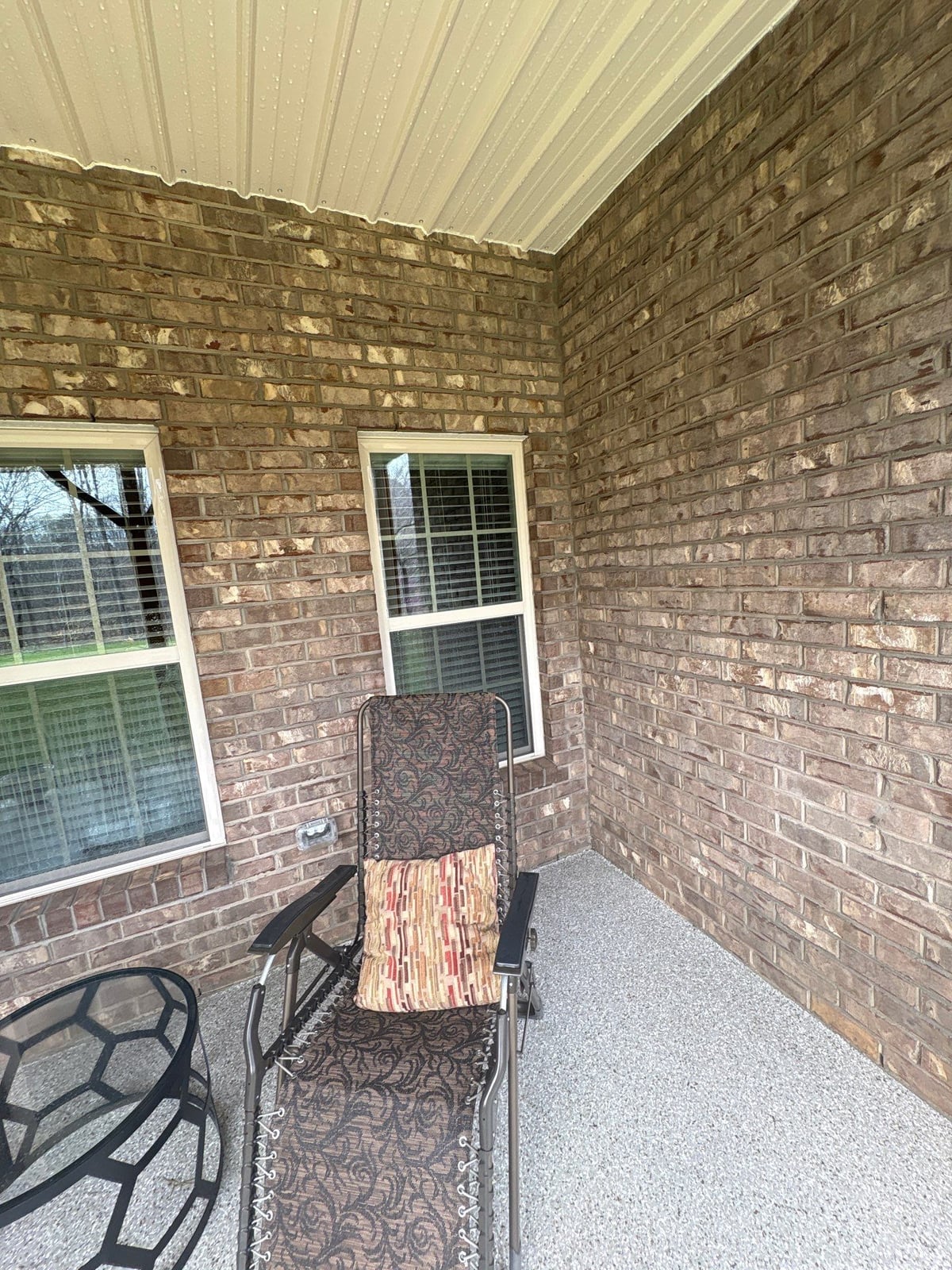 Exterior brick wall and garage door pressure washing