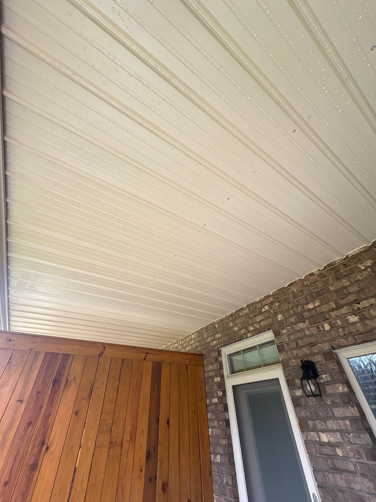 Exterior brick wall and garage door pressure washing