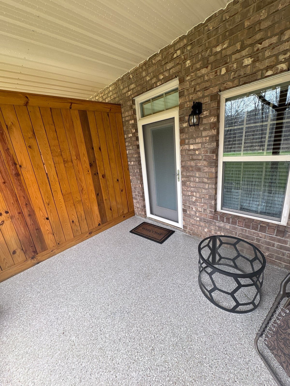 Exterior brick wall and garage door pressure washing