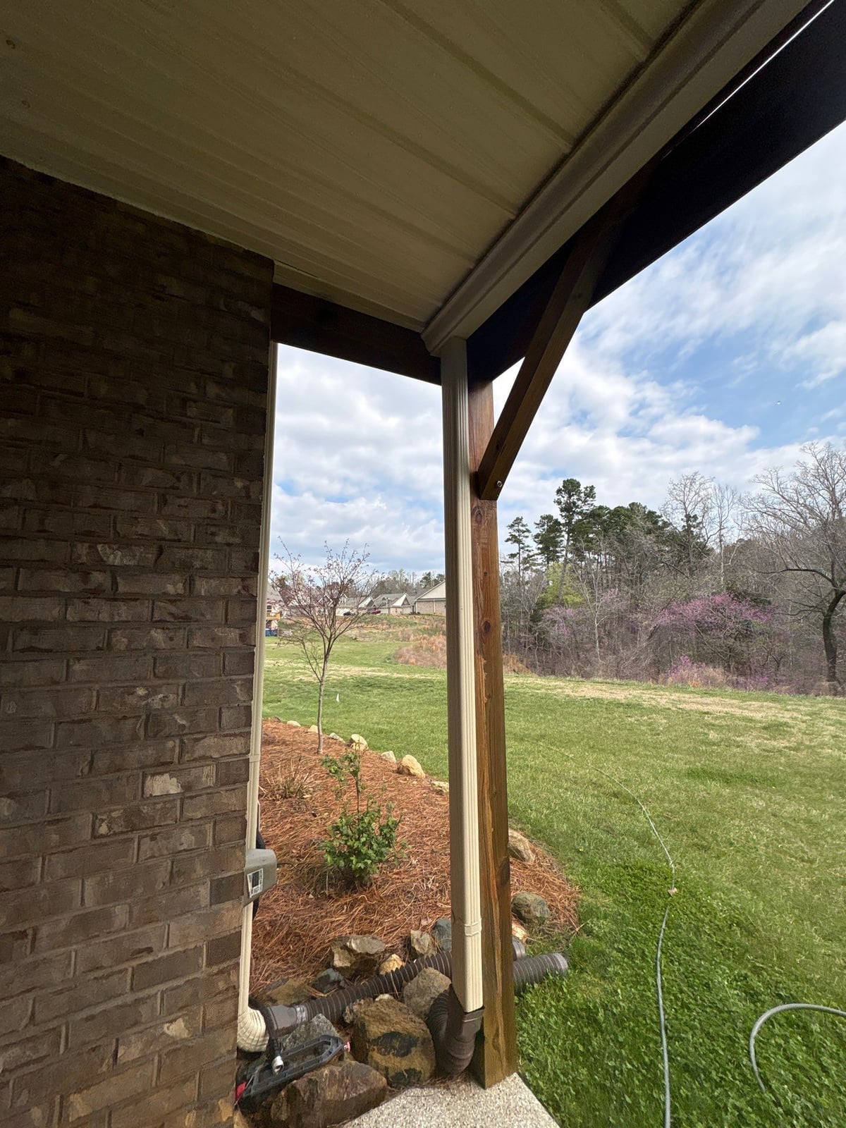 Exterior brick wall and garage door pressure washing