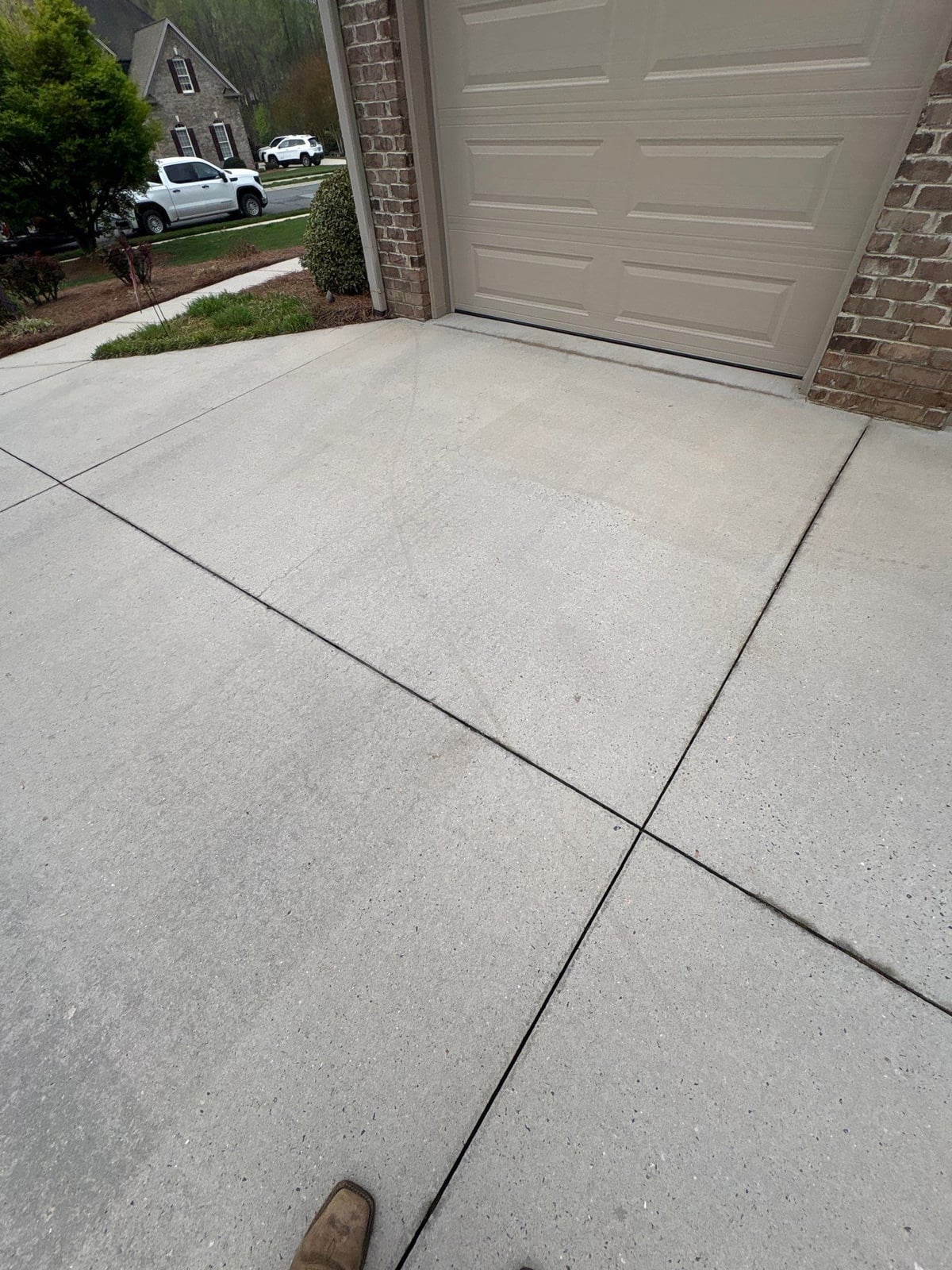 Driveway pressure washing and outdoor patio furniture cleaning