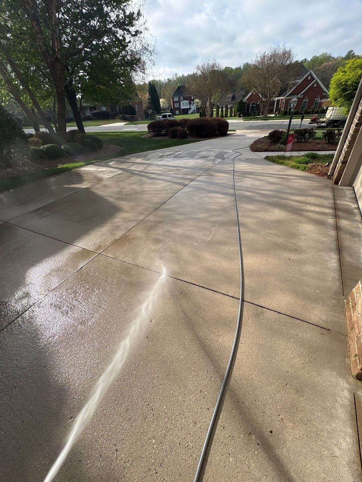Driveway pressure washing and outdoor patio furniture cleaning
