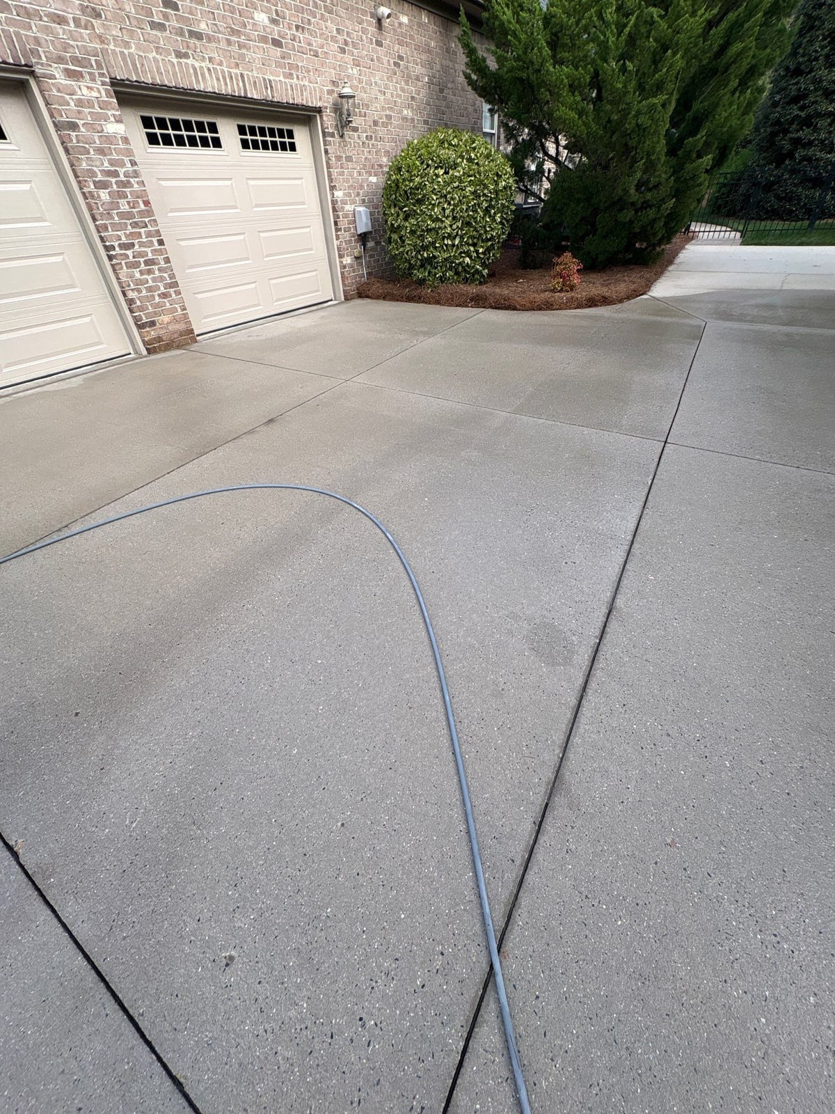 Driveway pressure washing and outdoor patio furniture cleaning