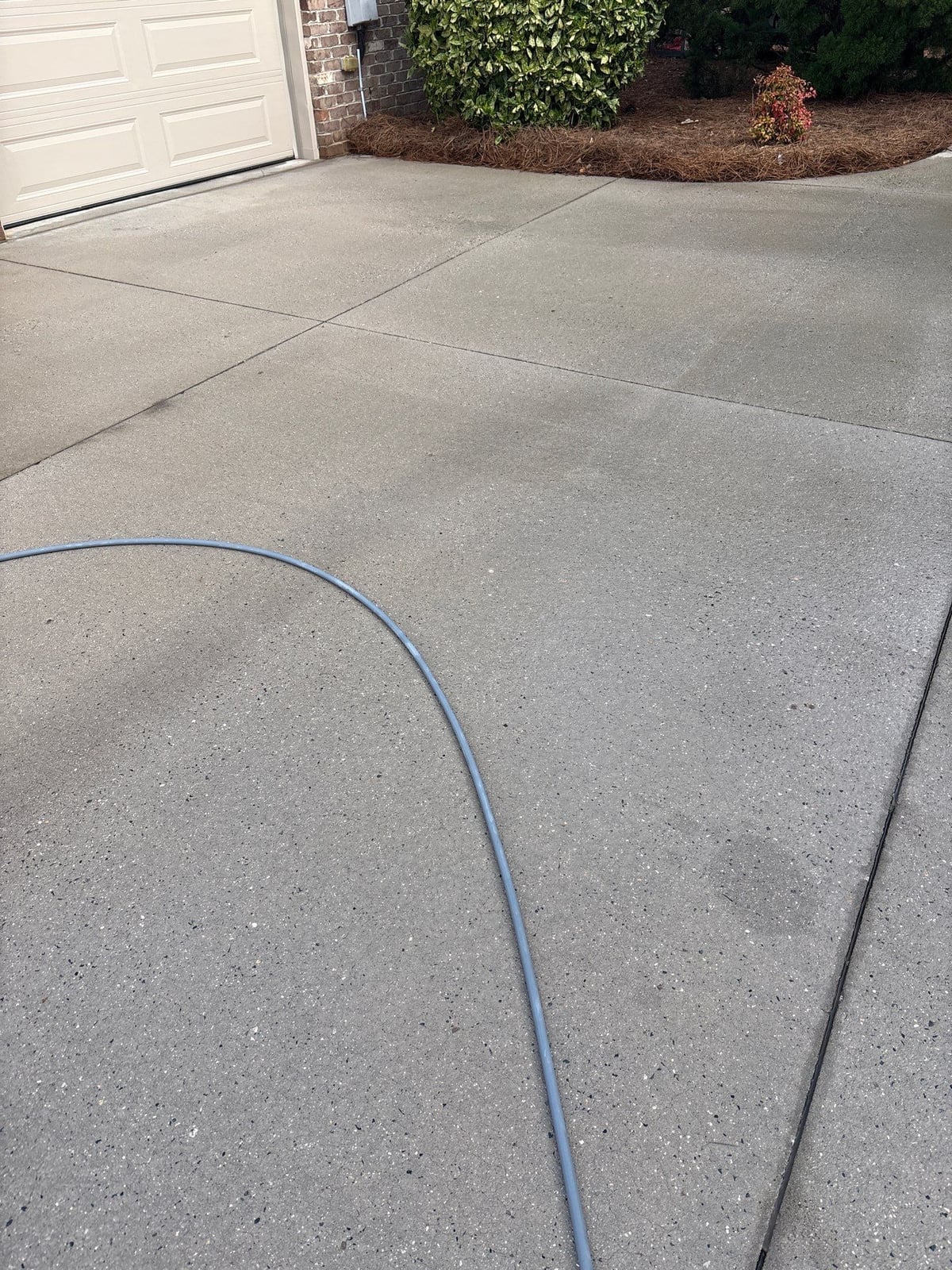 Driveway pressure washing and outdoor patio furniture cleaning