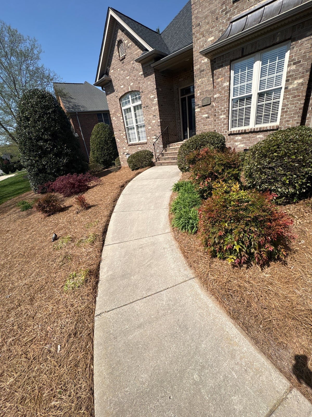 Driveway pressure washing and outdoor patio furniture cleaning
