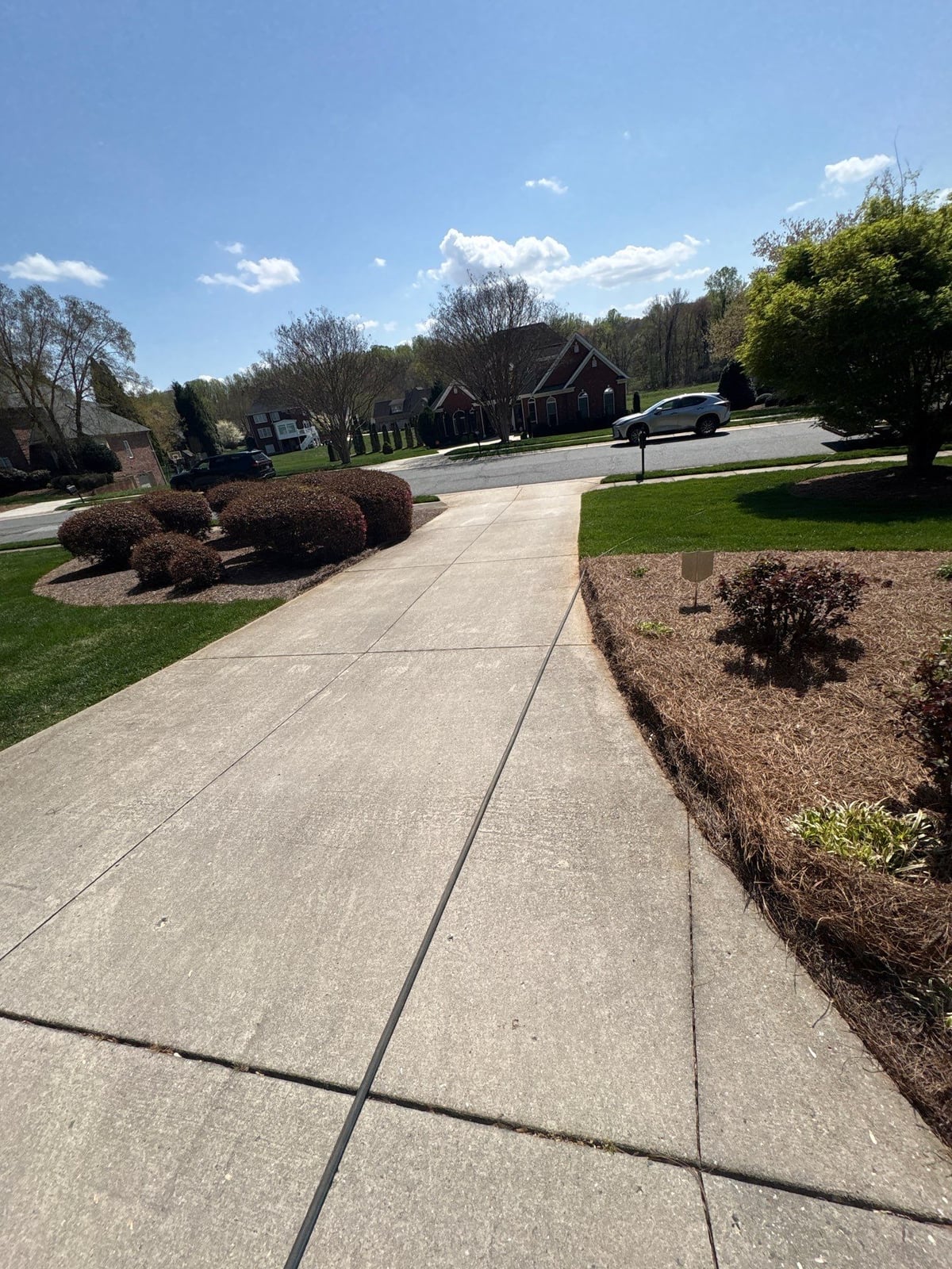 Driveway pressure washing and outdoor patio furniture cleaning