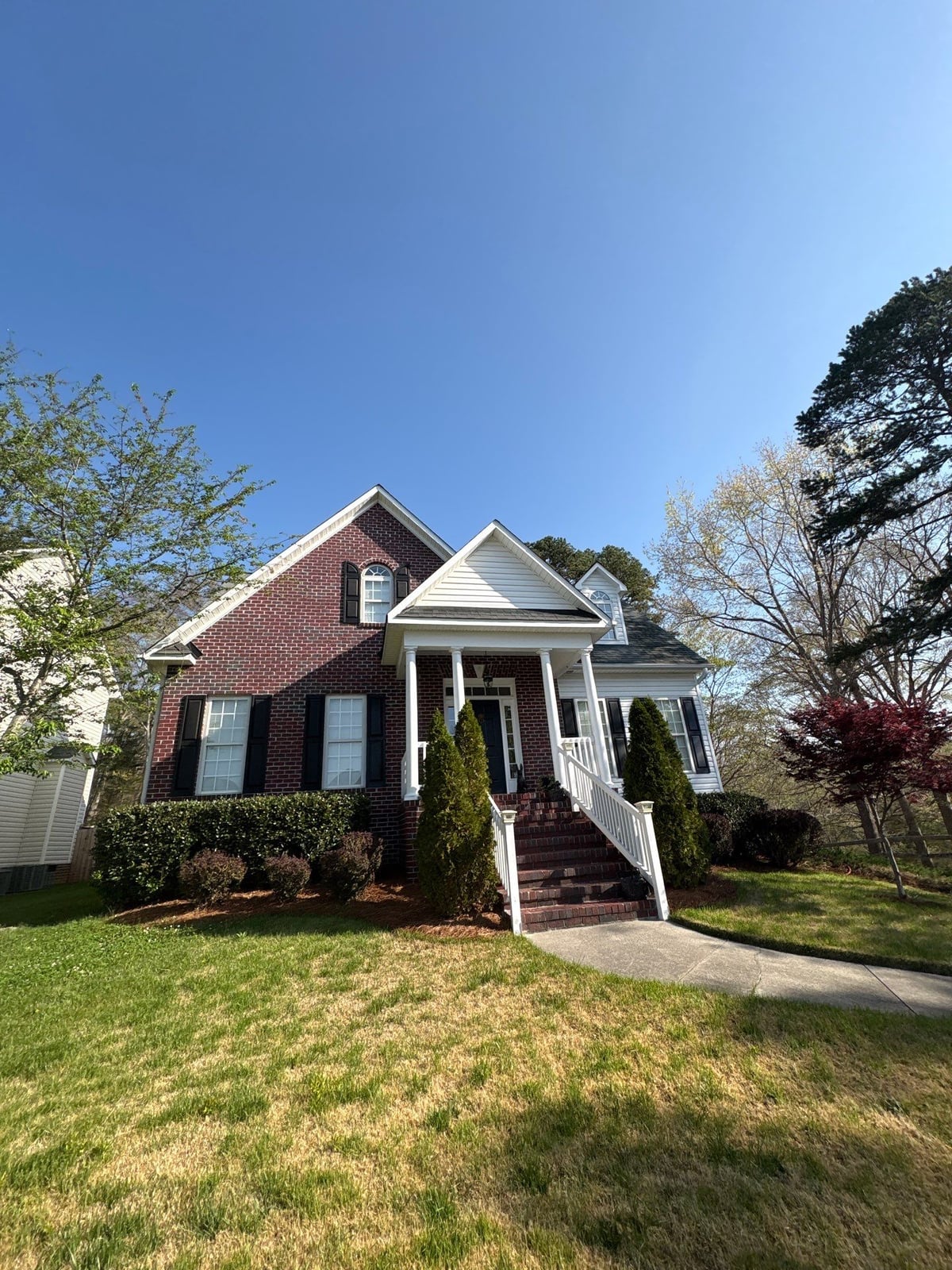 Exterior soft washing of siding and wood deck railings
