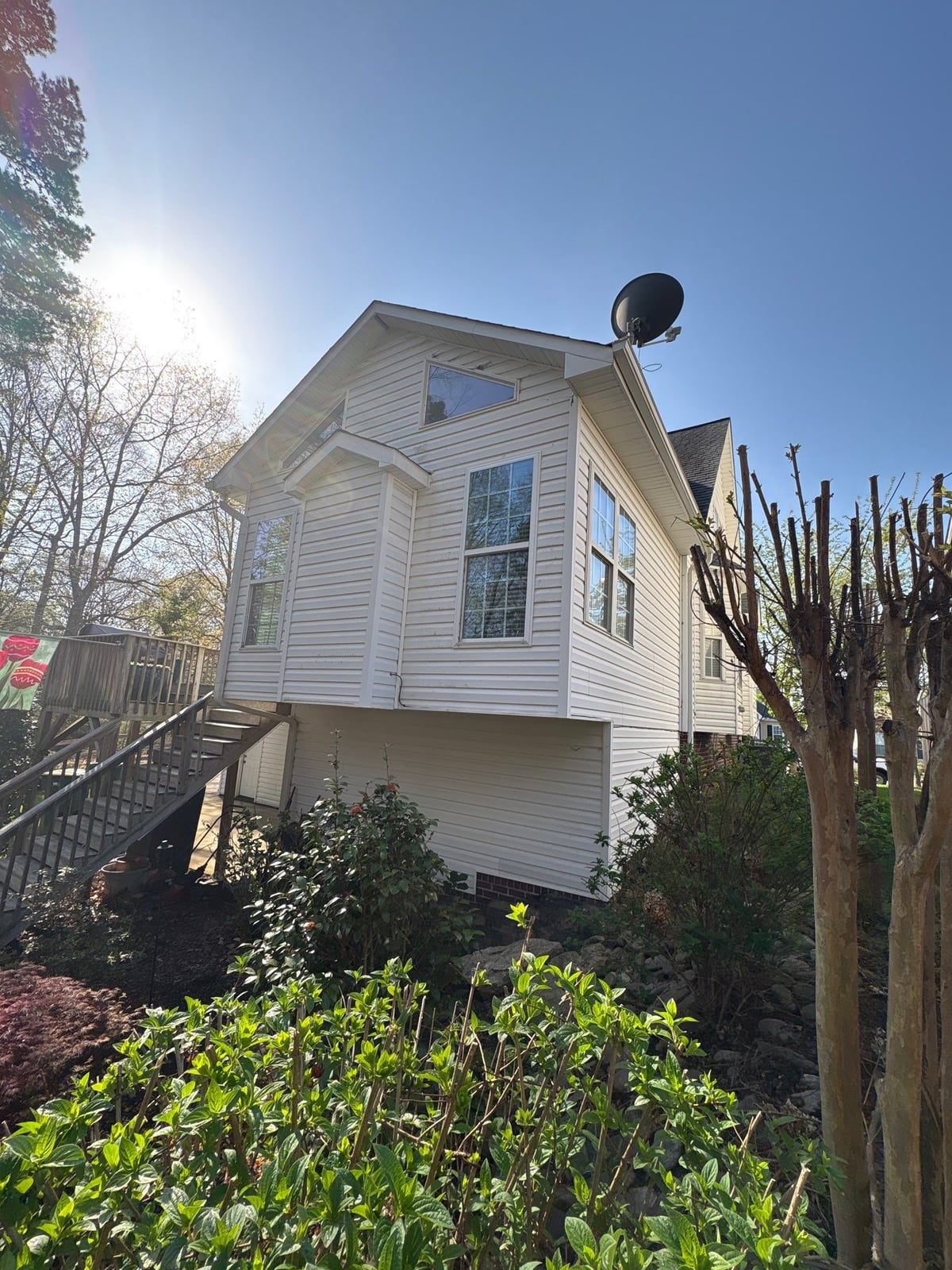 Exterior soft washing of siding and wood deck railings