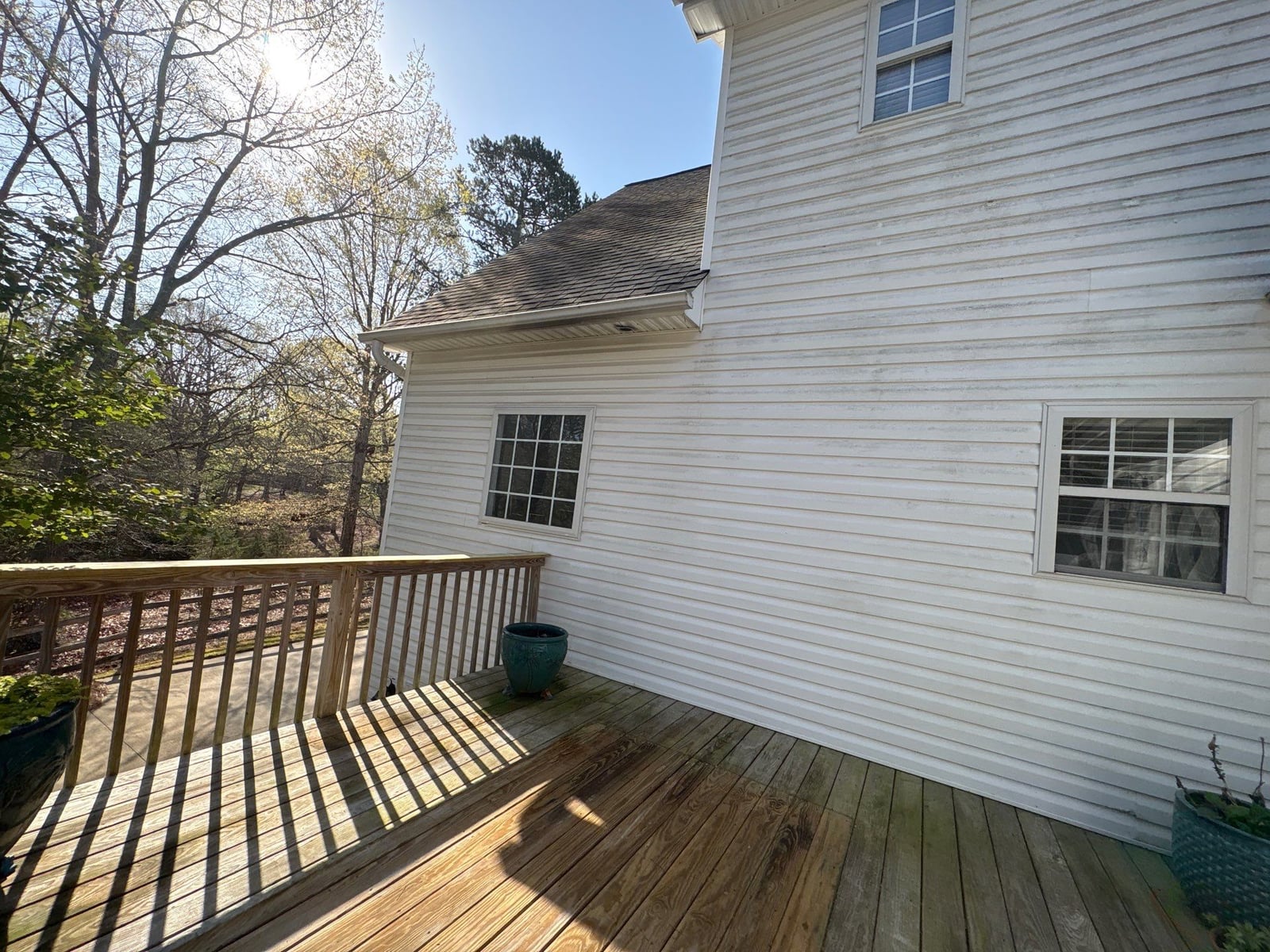 Exterior soft washing of siding and wood deck railings