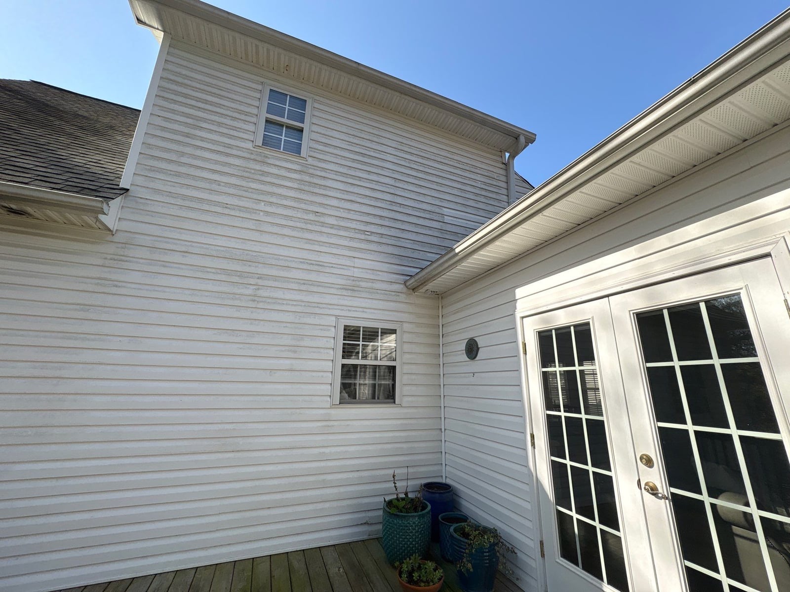 Exterior soft washing of siding and wood deck railings