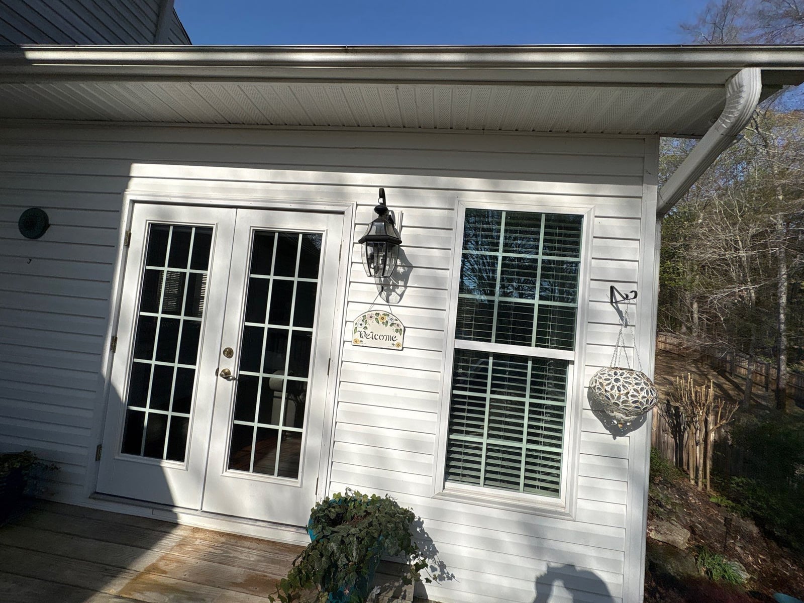 Exterior soft washing of siding and wood deck railings