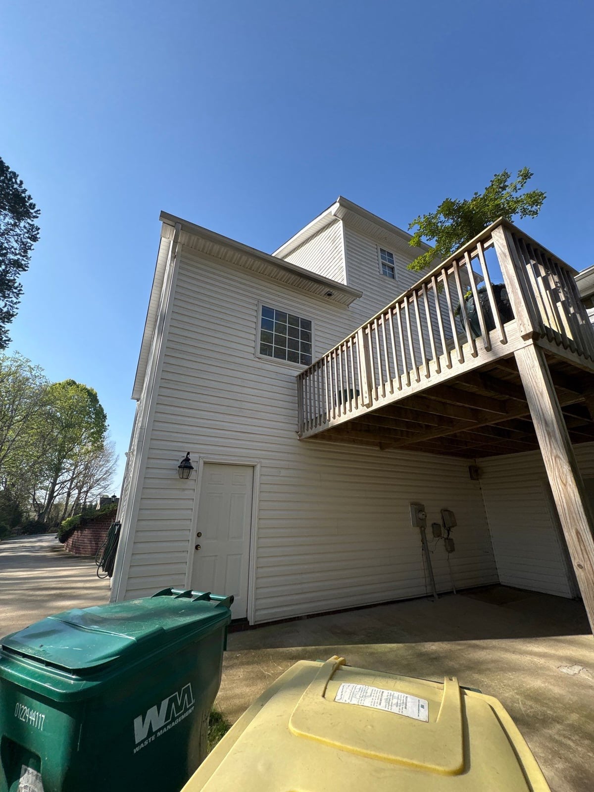 Exterior soft washing of siding and wood deck railings
