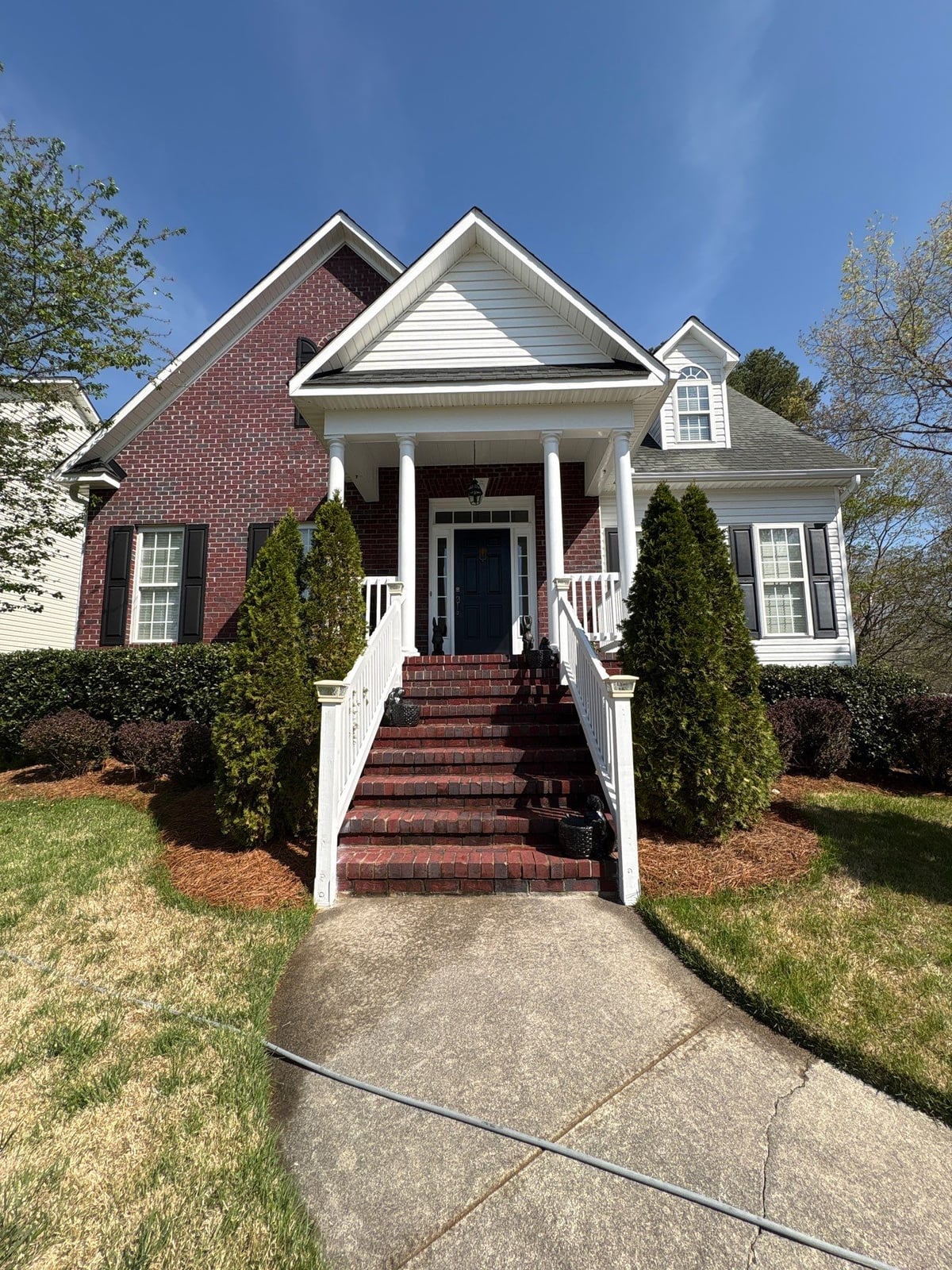 Exterior soft washing of siding and wood deck railings