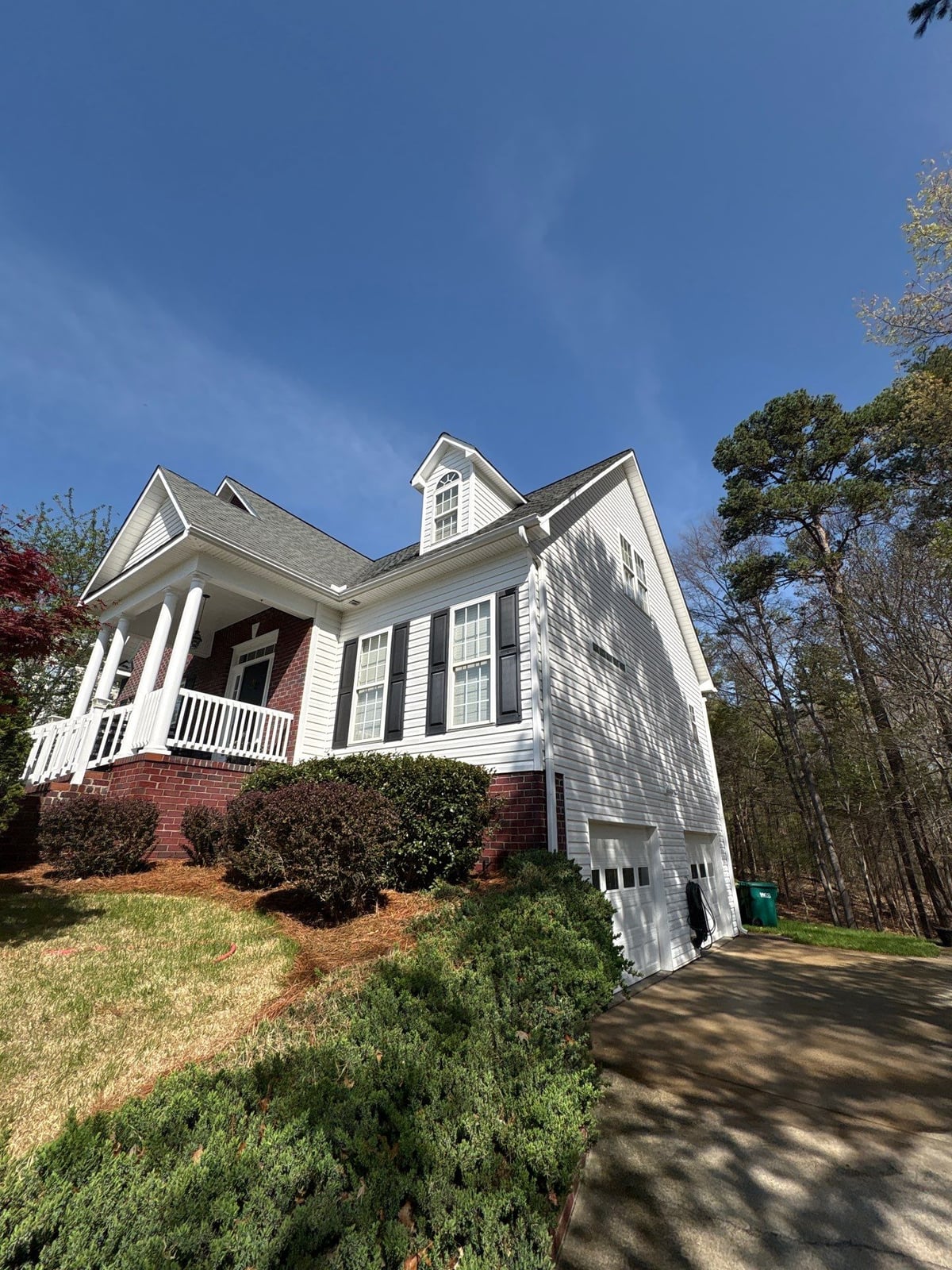 Exterior soft washing of siding and wood deck railings