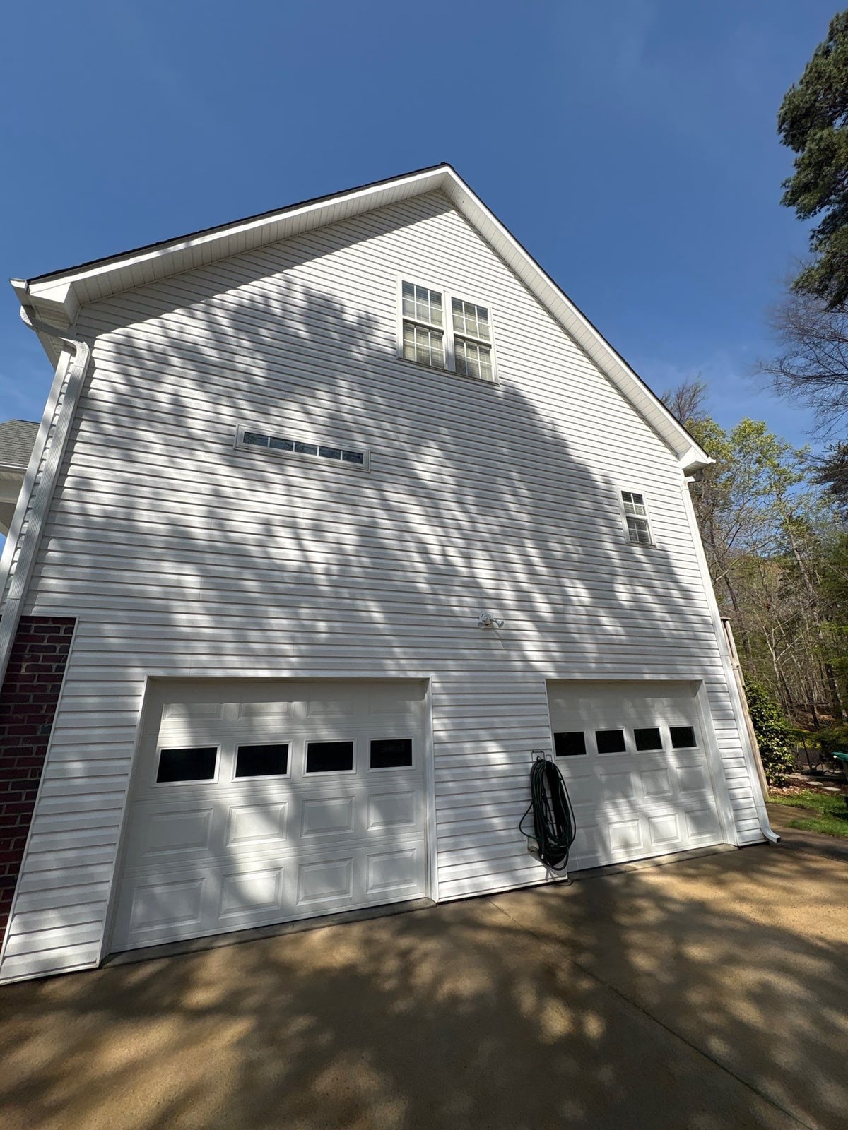 Exterior soft washing of siding and wood deck railings