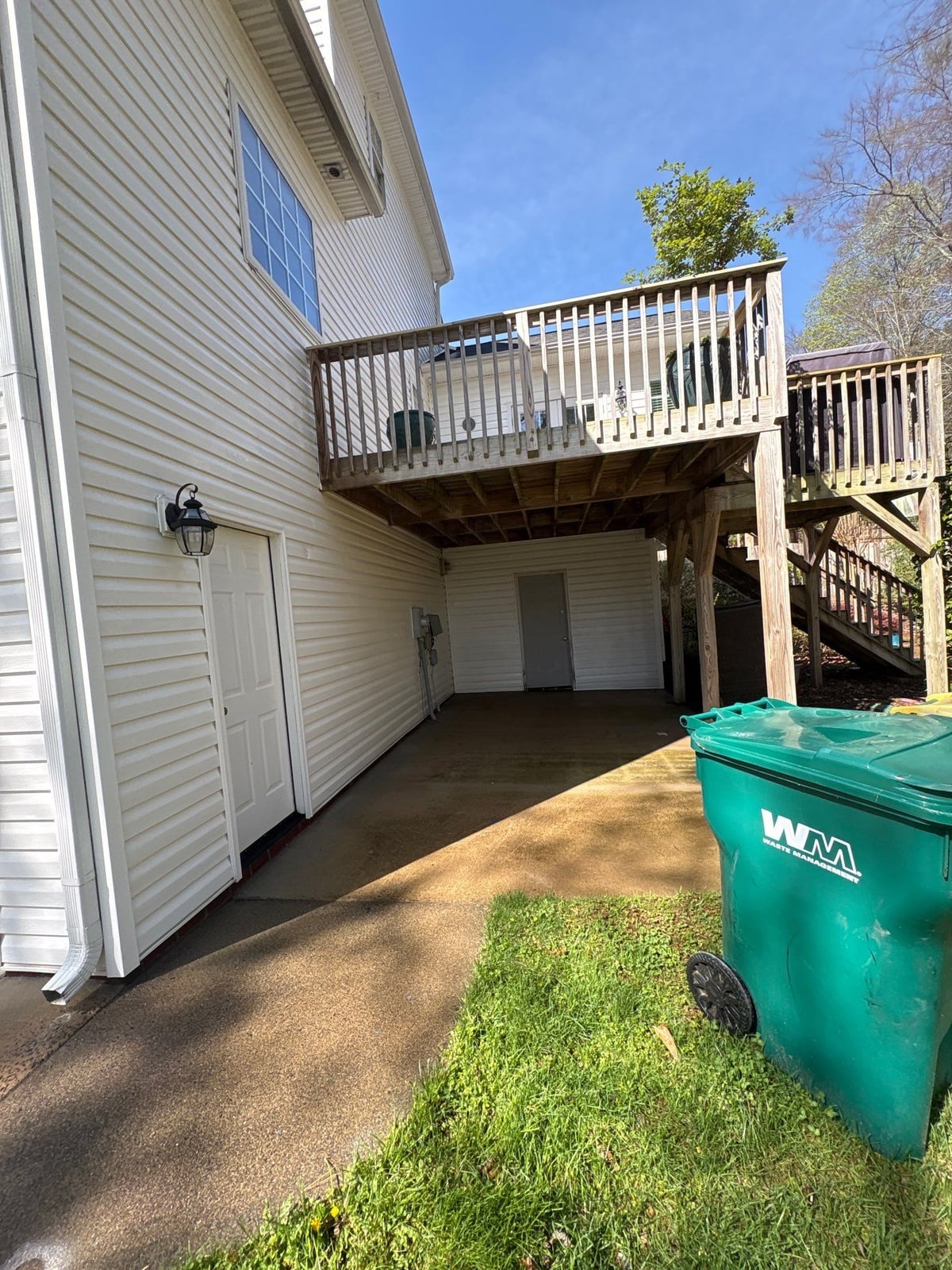 Exterior soft washing of siding and wood deck railings