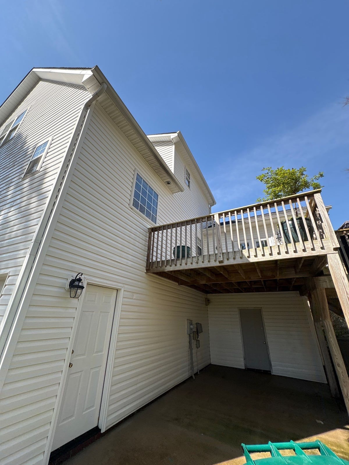 Exterior soft washing of siding and wood deck railings