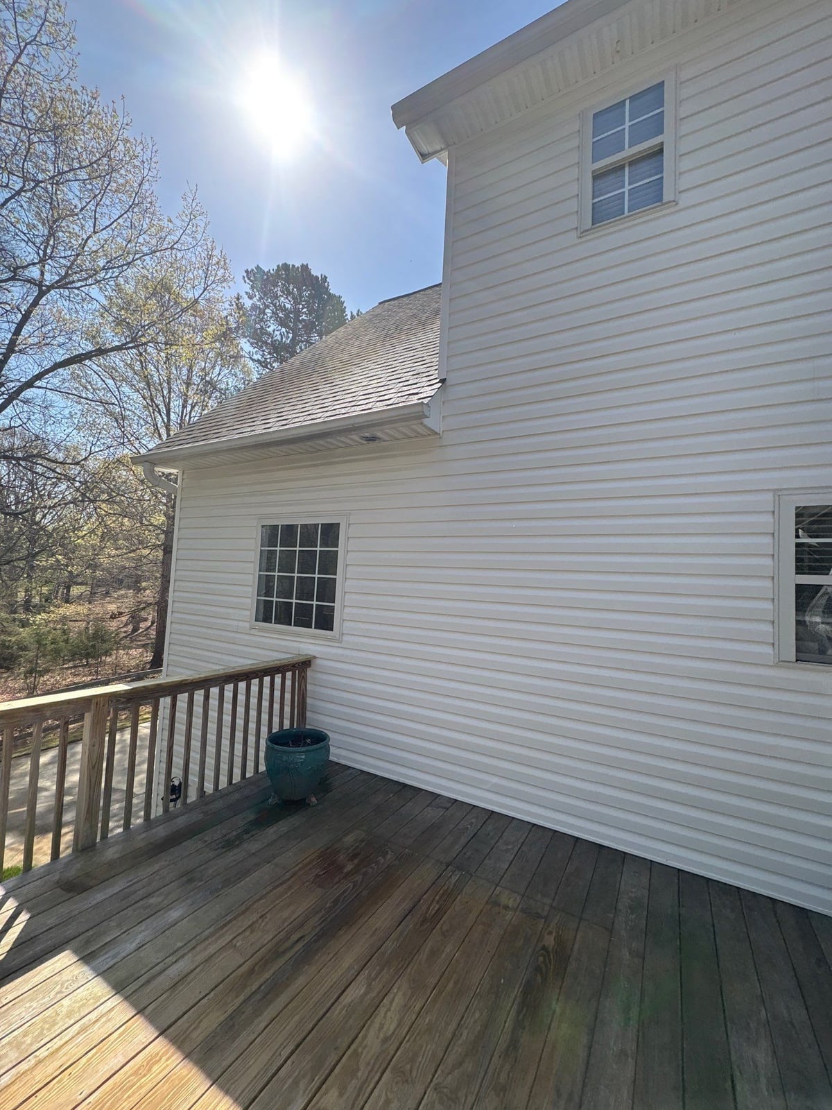 Exterior soft washing of siding and wood deck railings
