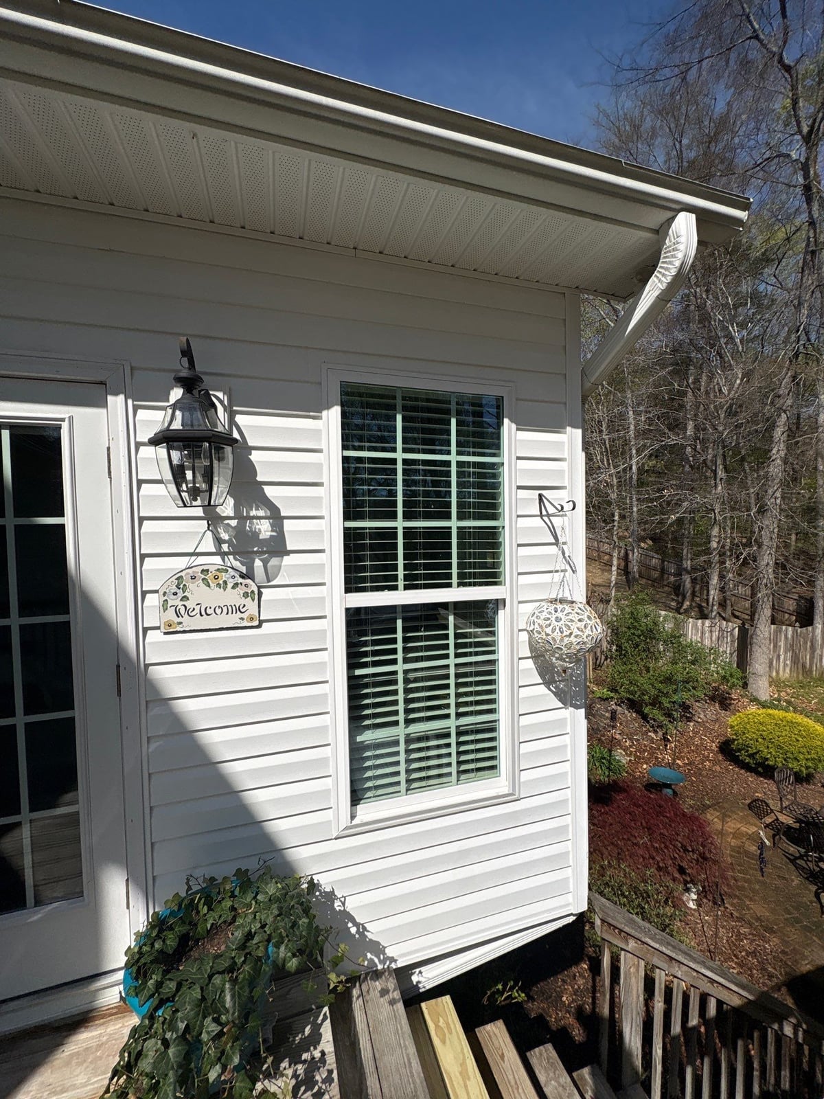 Exterior soft washing of siding and wood deck railings