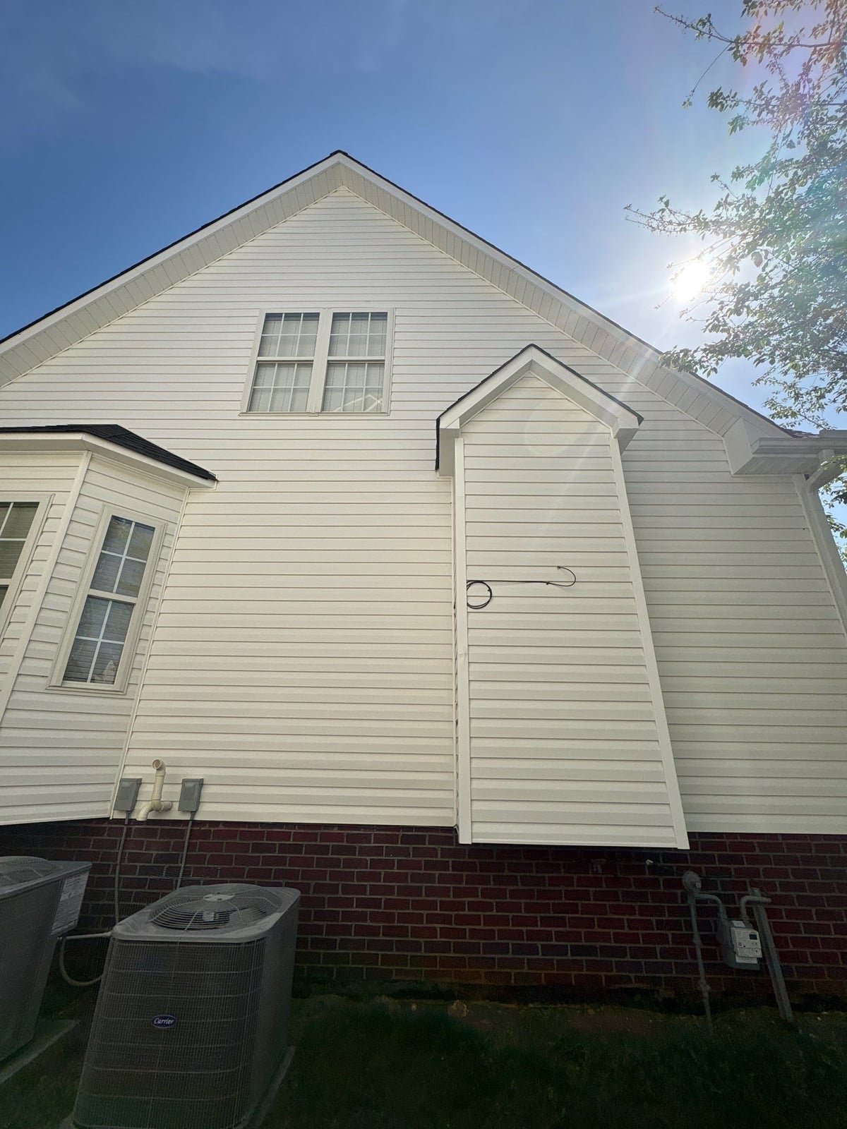 Exterior soft washing of siding and wood deck railings