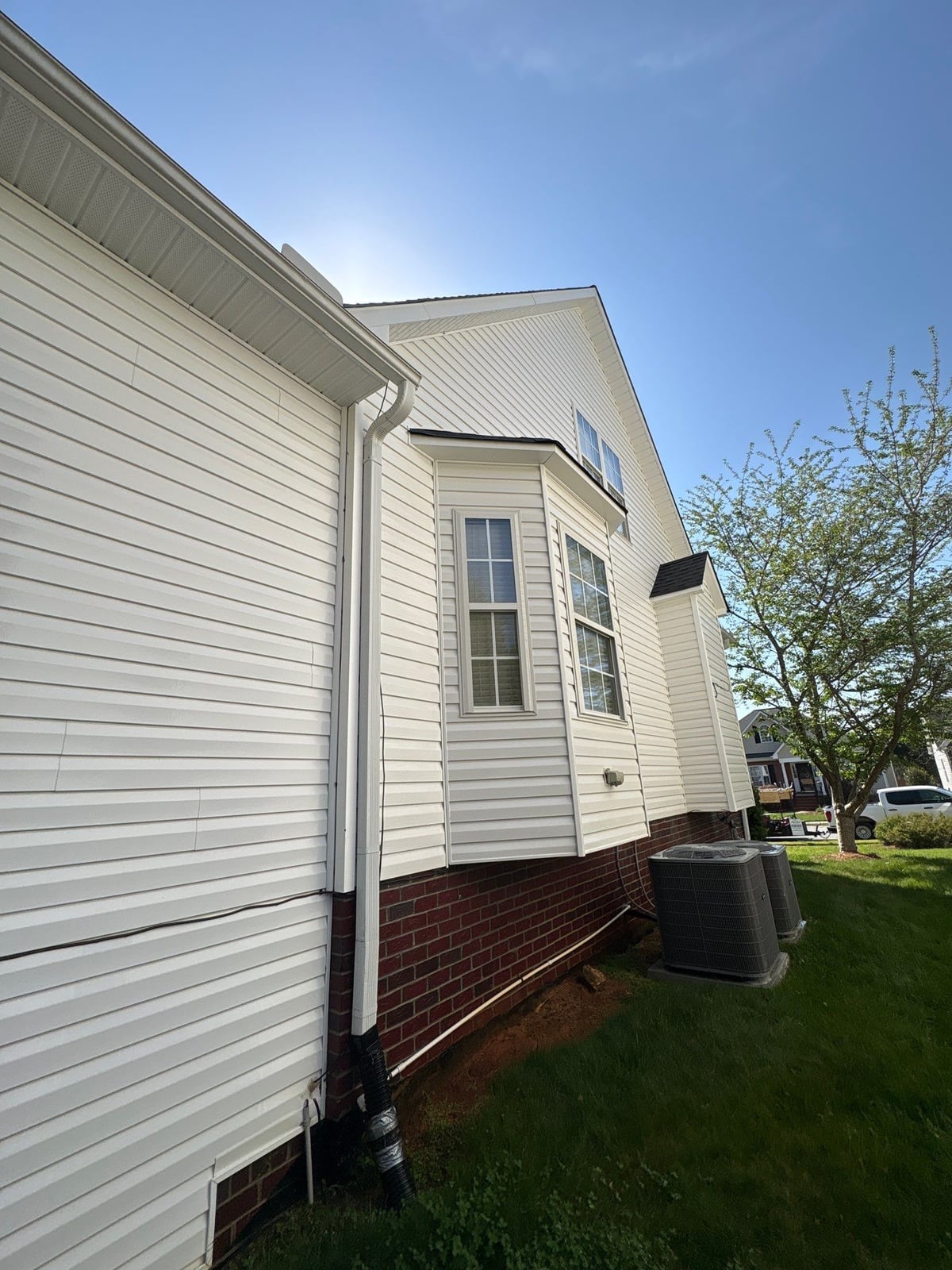 Exterior soft washing of siding and wood deck railings