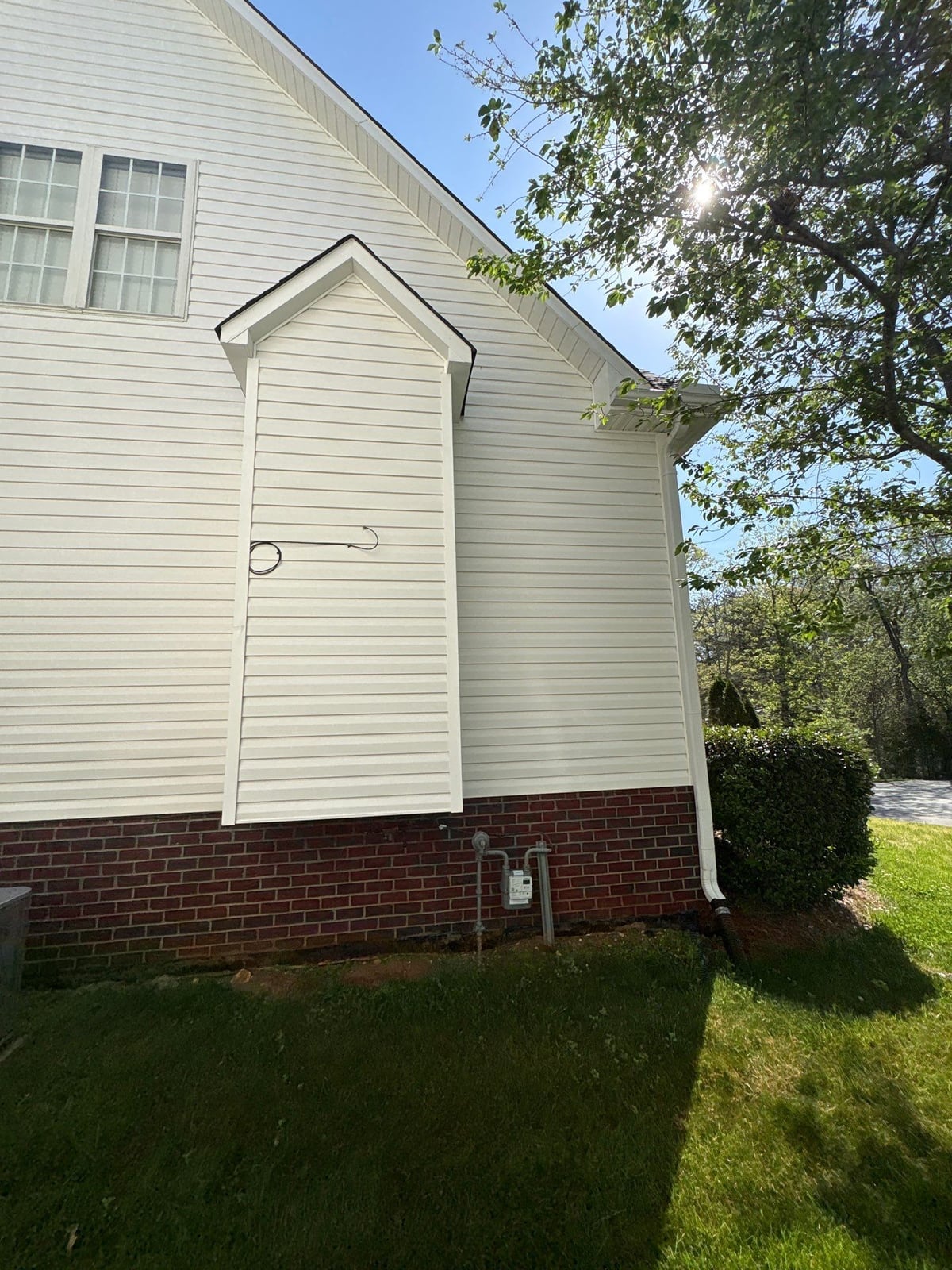 Exterior soft washing of siding and wood deck railings