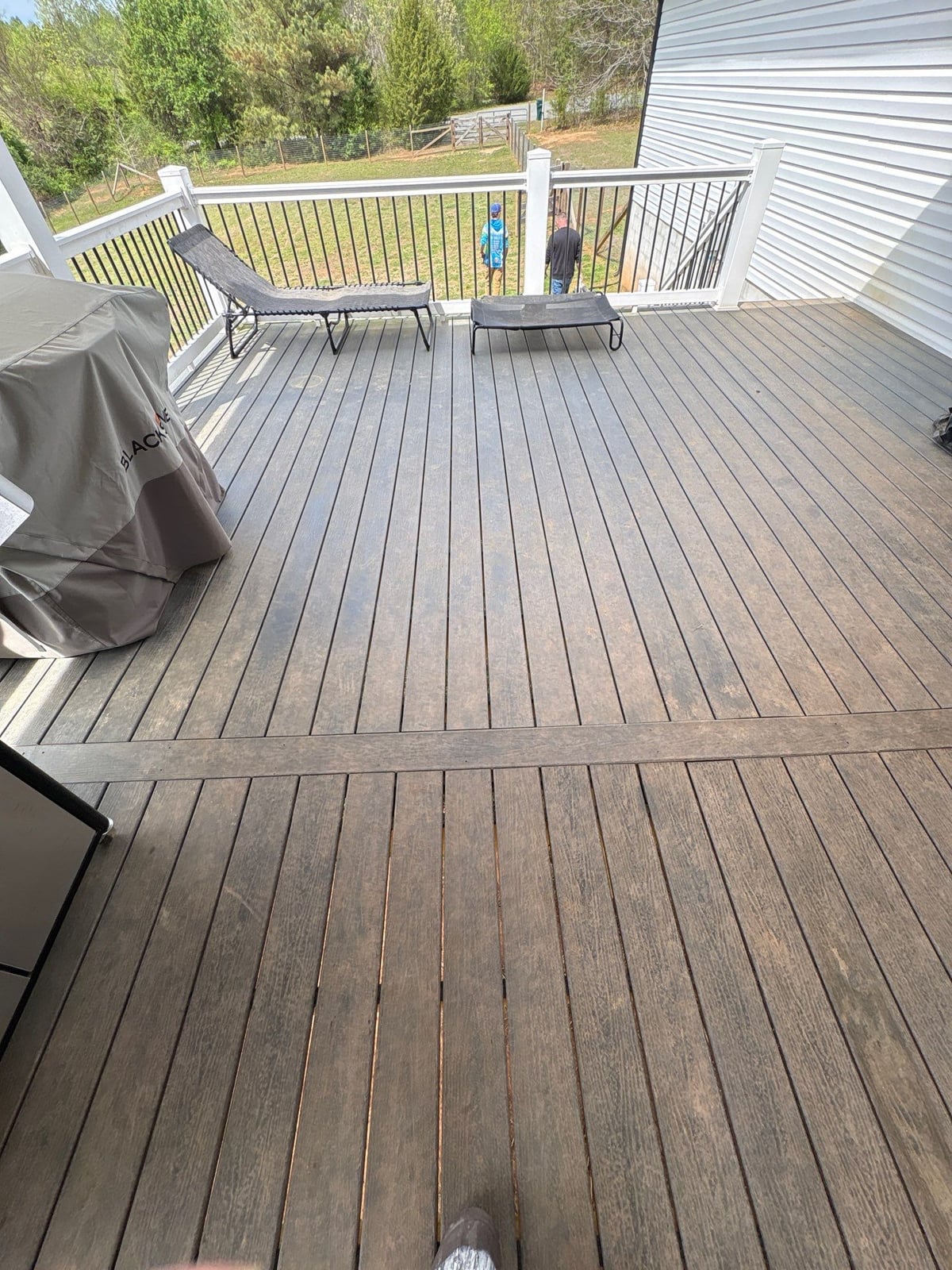 Soft washing exterior siding and porch surfaces