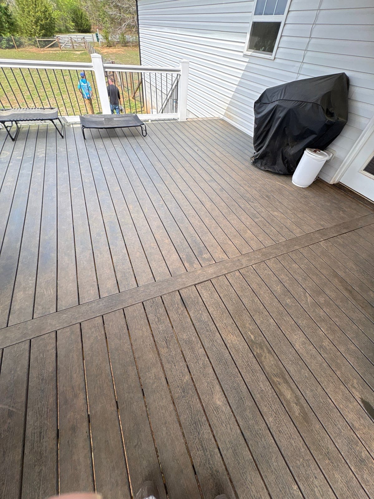 Soft washing exterior siding and porch surfaces