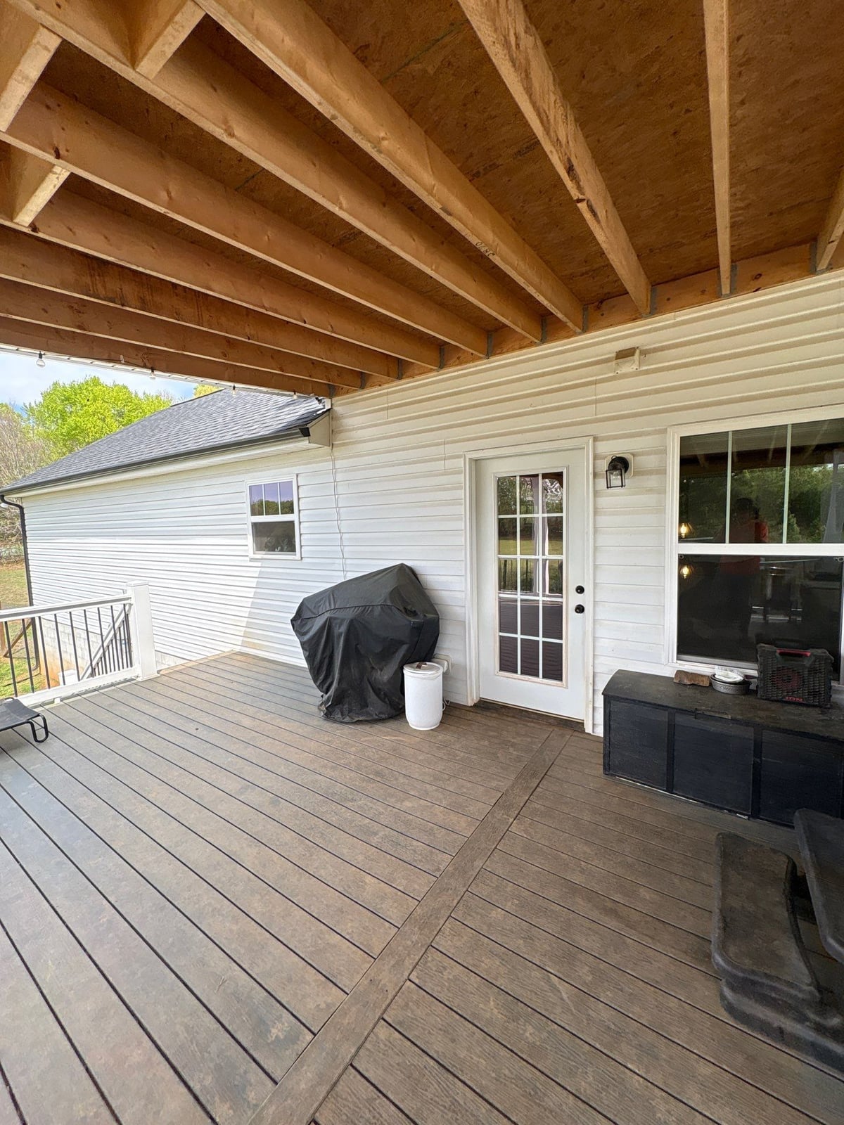 Soft washing exterior siding and porch surfaces