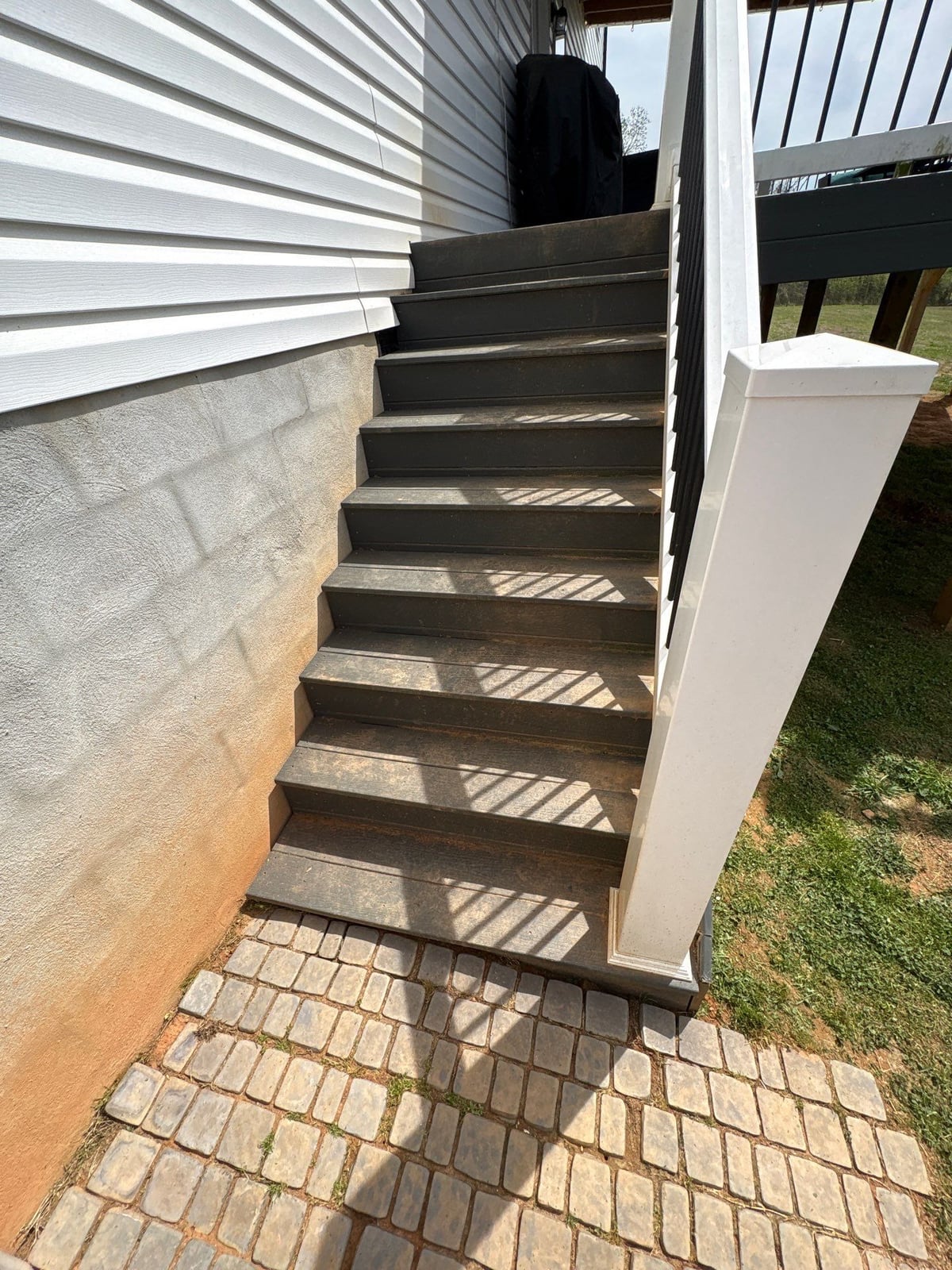 Soft washing exterior siding and porch surfaces