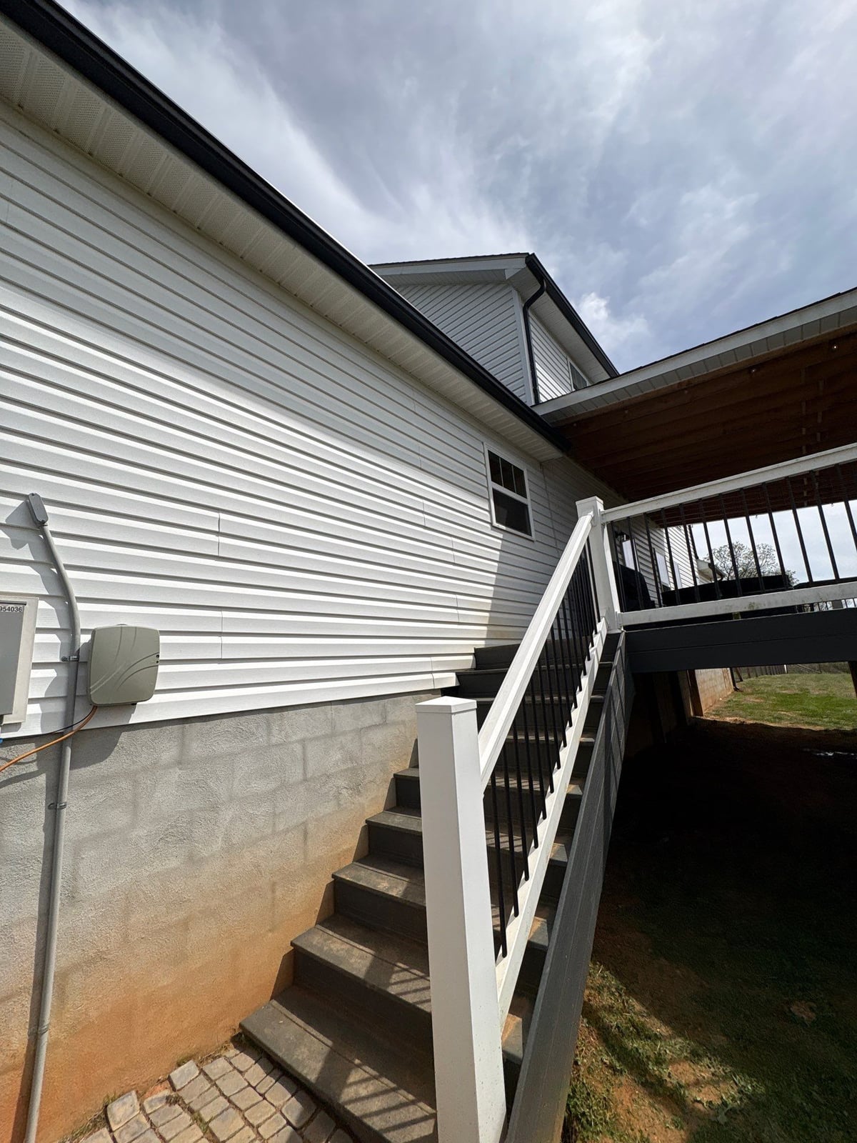 Soft washing exterior siding and porch surfaces