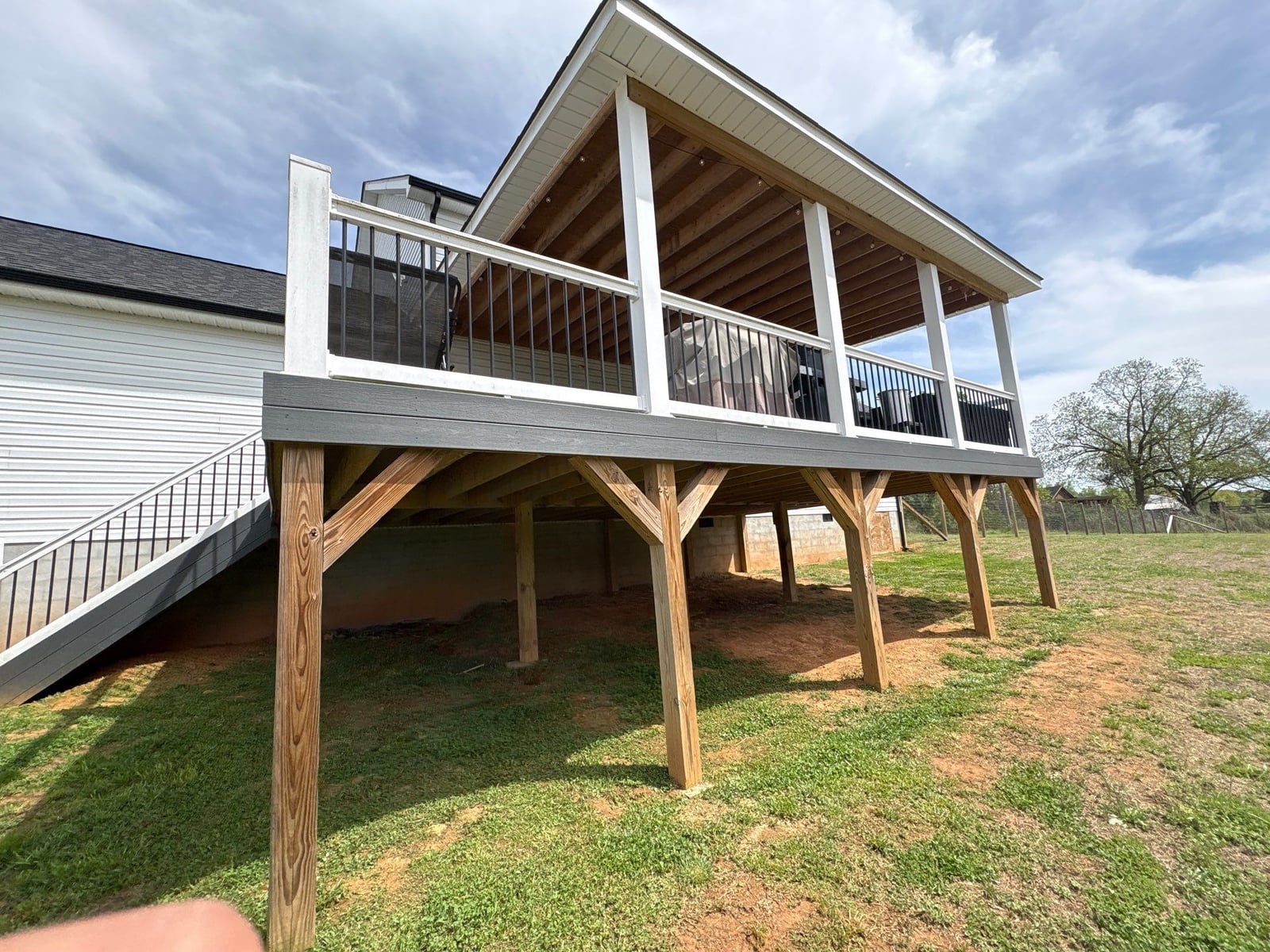 Soft washing exterior siding and porch surfaces