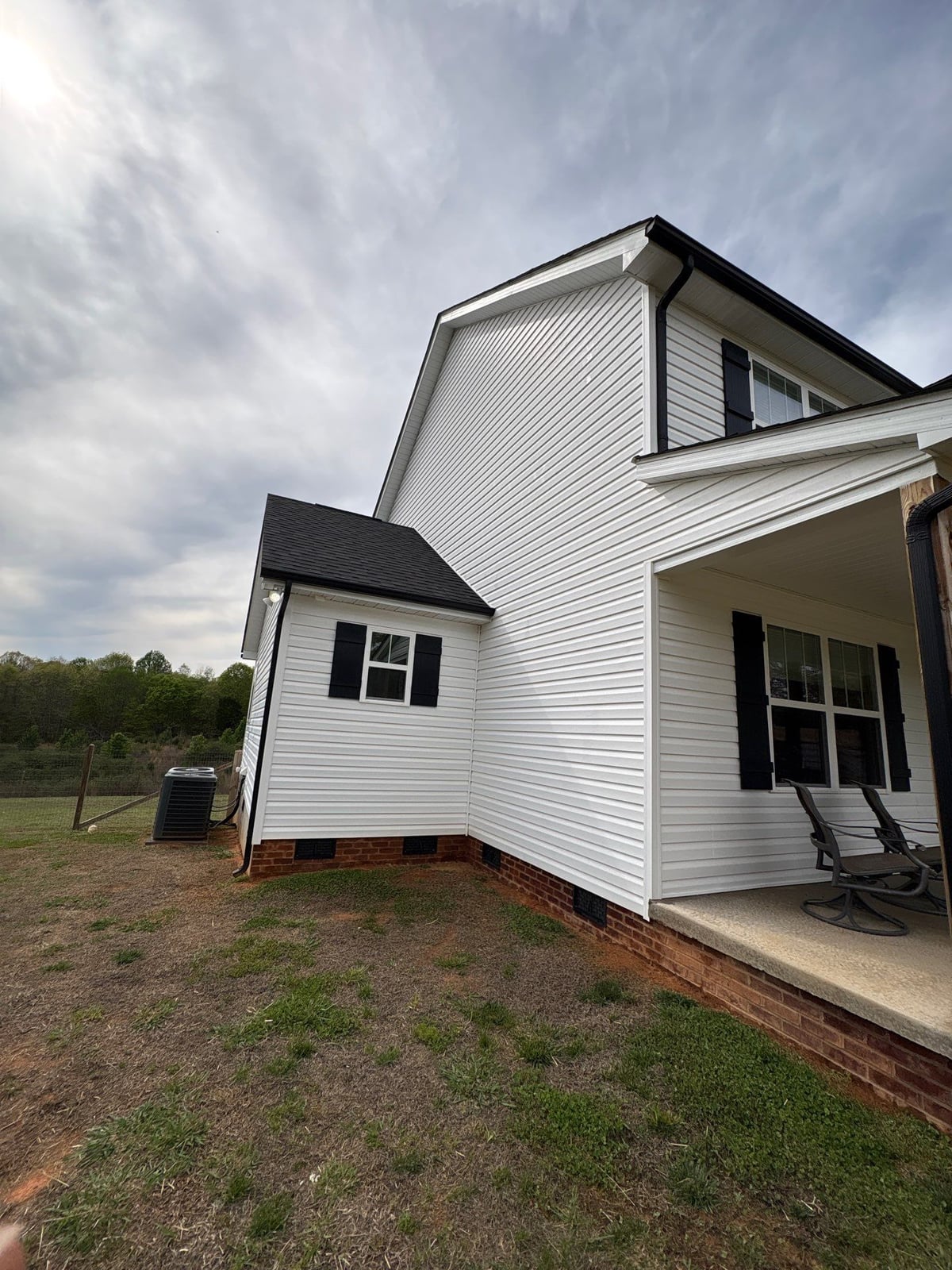 Soft washing exterior siding and porch surfaces