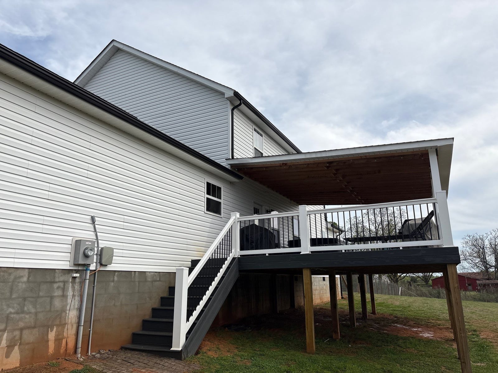 Soft washing exterior siding and porch surfaces
