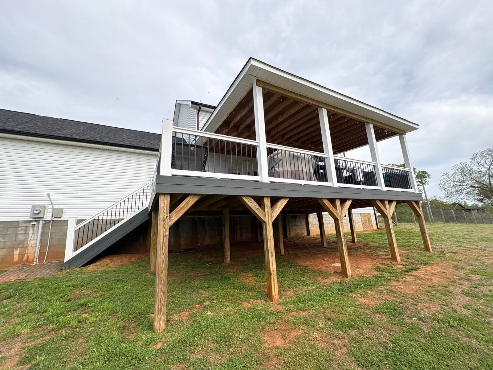 Soft washing exterior siding and porch surfaces